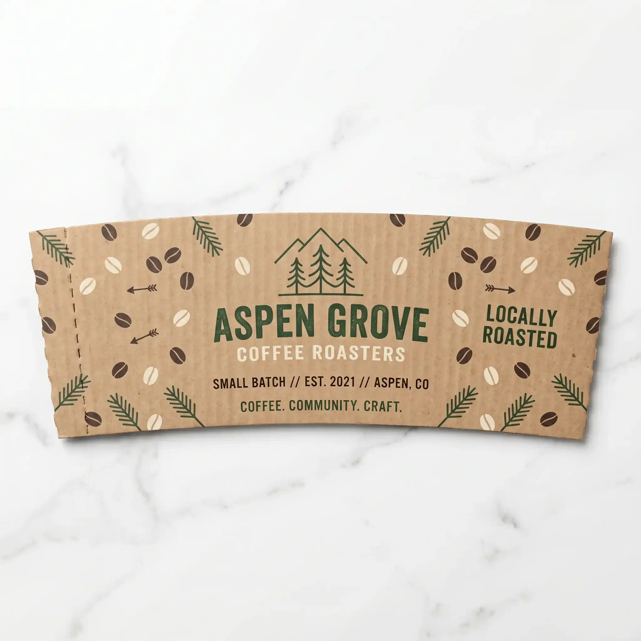 Brown kraft paper coffee cup sleeve with Aspen Grove Coffee Roasters branding, featuring coffee bean pattern and forest logo design