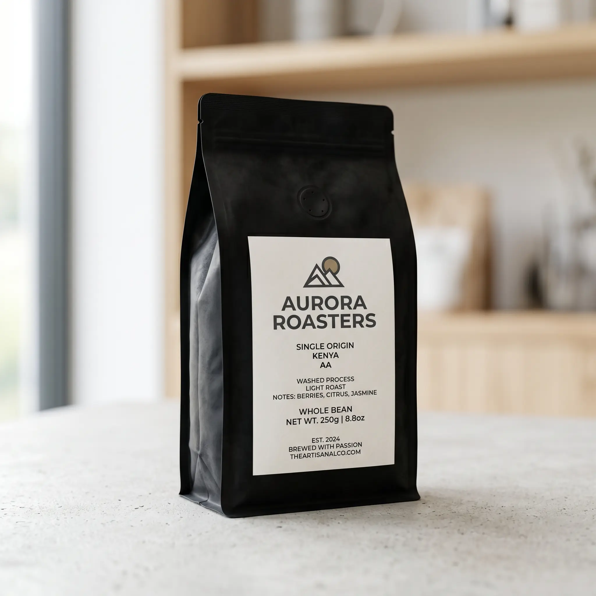 Aurora Roasters black coffee bag with white label showing Kenya AA single origin beans on marble counter in bright kitchen