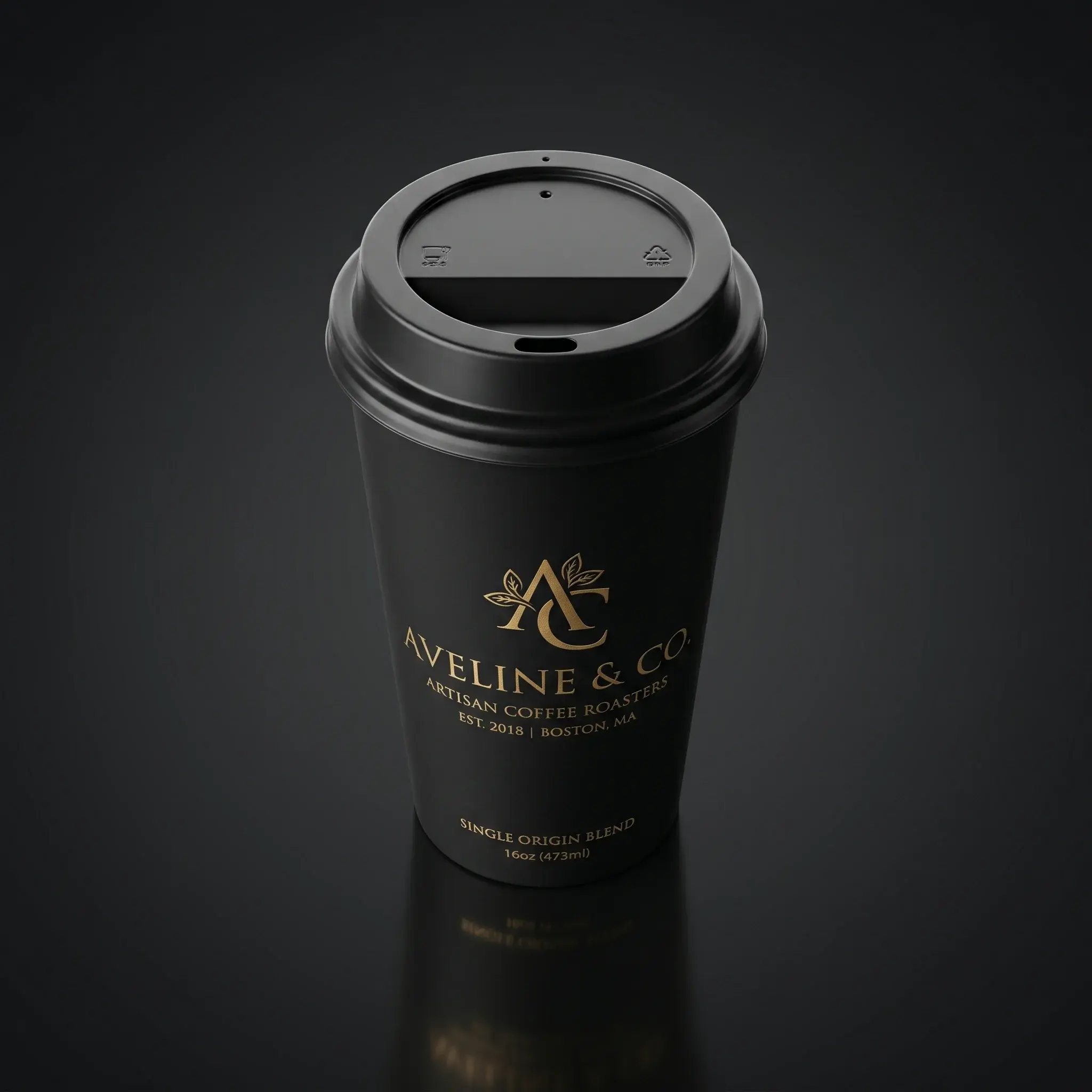 Black coffee cup with gold Aveline & Co logo on dark background showcasing premium packaging design for artisan coffee roasters