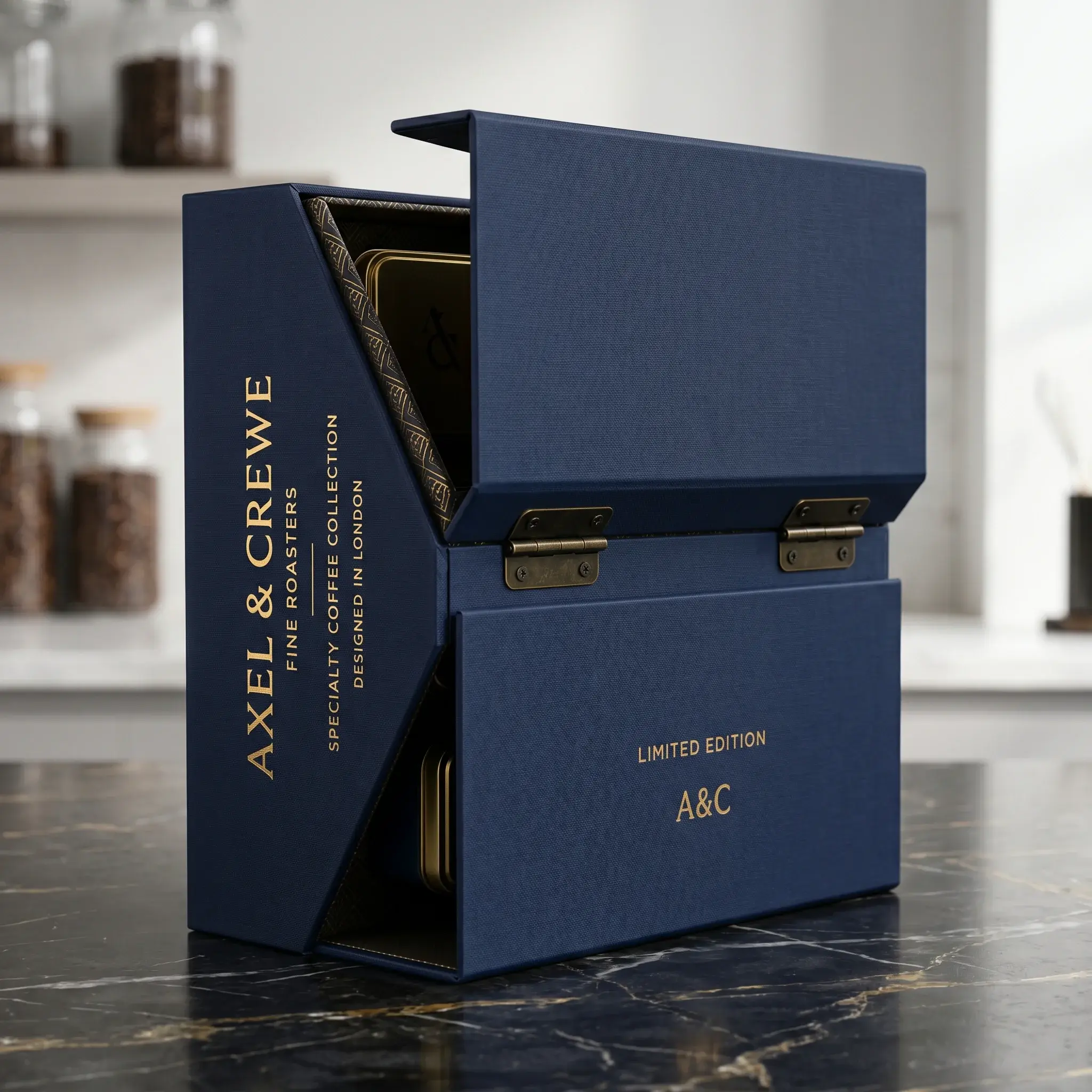 Luxury navy blue coffee packaging box with gold lettering opens to reveal premium coffee collection on marble kitchen counter