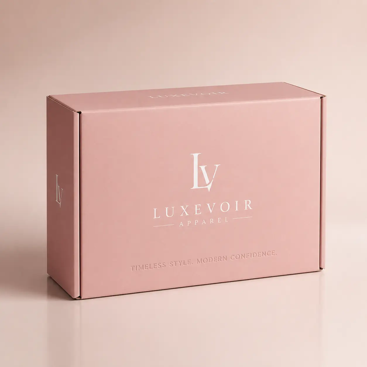 Luxevoir Apparel blush pink custom mailer box with white LV monogram logo, luxury retail packaging by The Packaging Masters