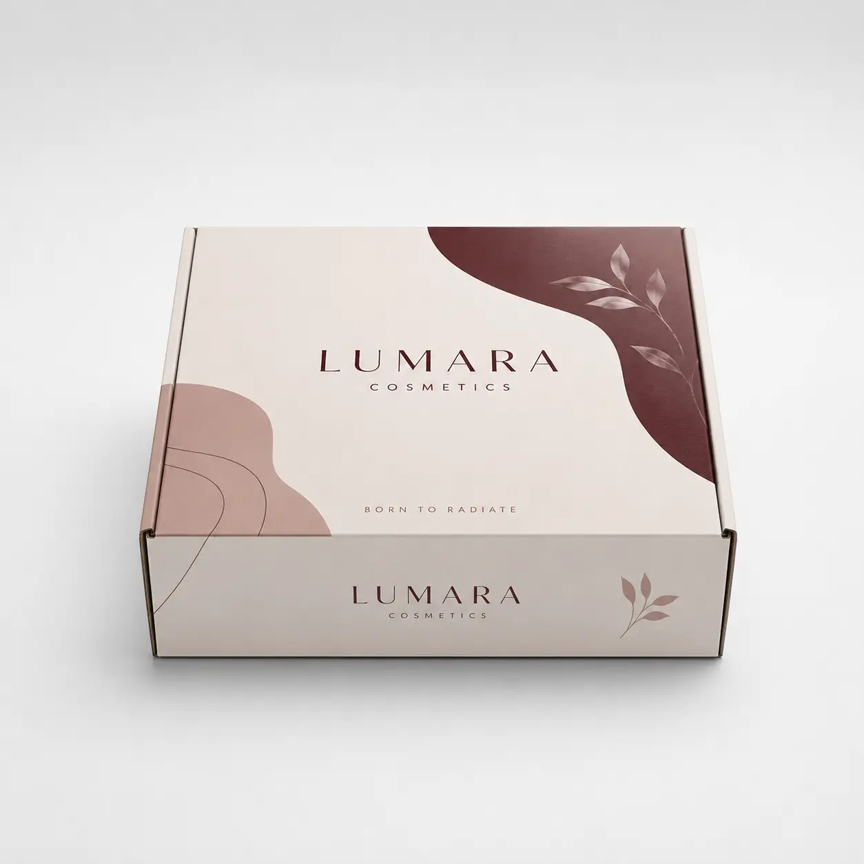 Lumara Cosmetics elegant mailer box in blush beige with burgundy botanical design and Born To Radiate tagline custom packaging