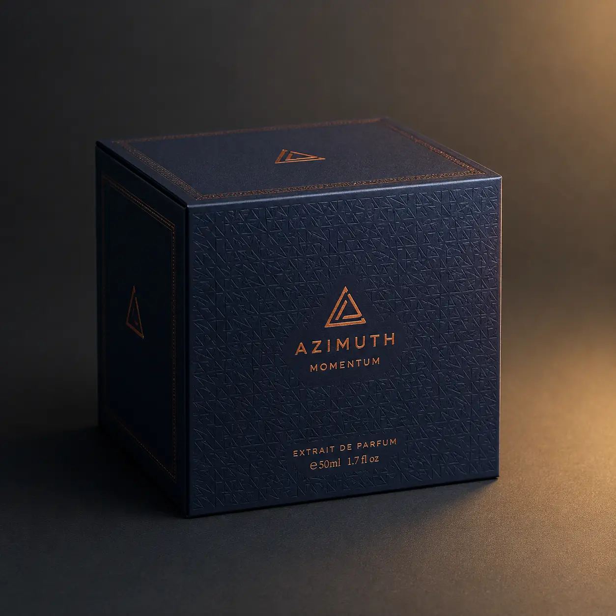 Luxury navy blue Azimuth Momentum extrait de parfum 50ml box with copper foil logo and geometric embossed pattern on dark background