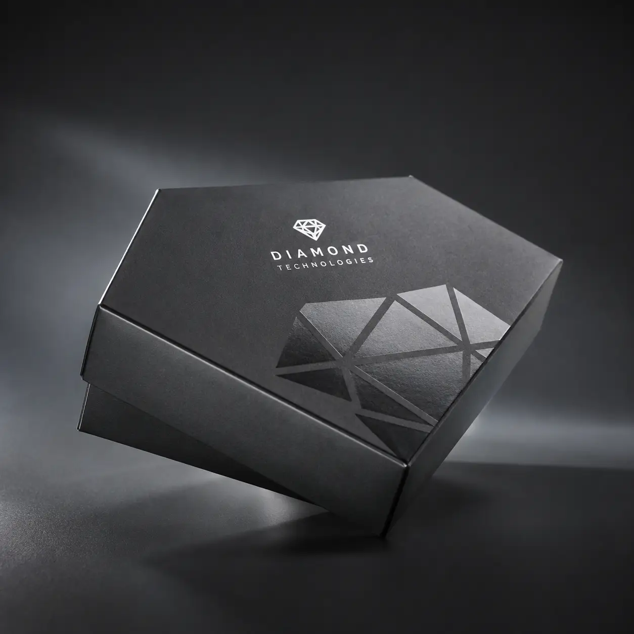 Luxury black hexagonal rigid box with silver Diamond Technologies logo and geometric foil pattern, premium custom packaging design
