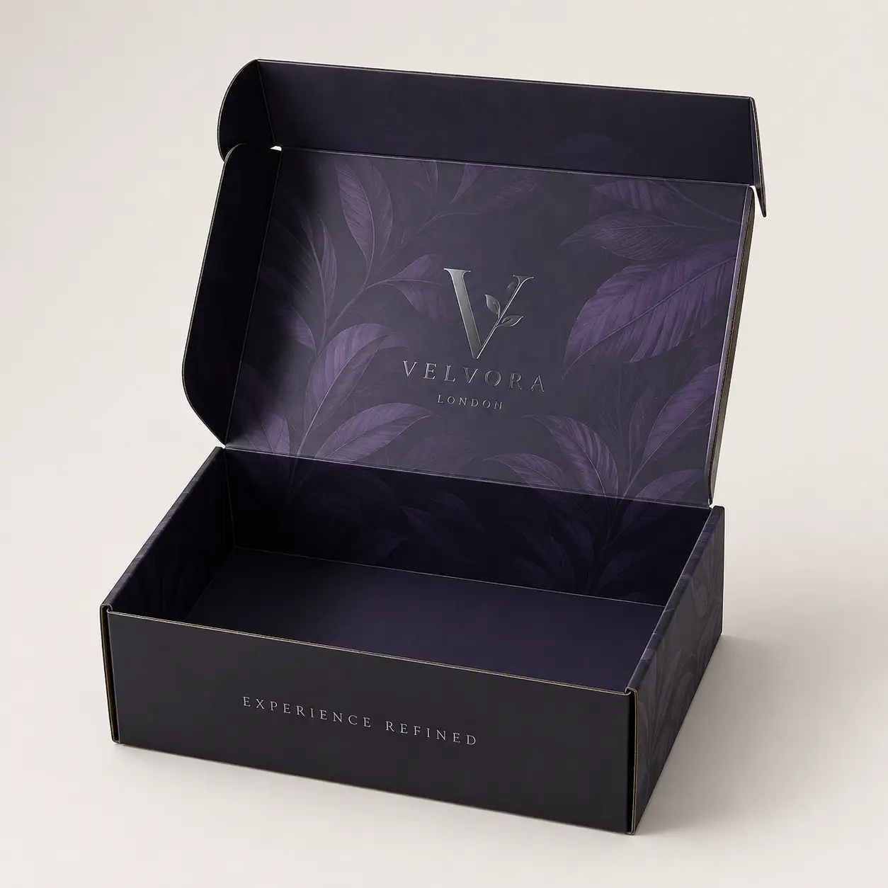 Luxury black mailer box open revealing purple botanical interior with Velvora London silver logo and Experience Refined tagline