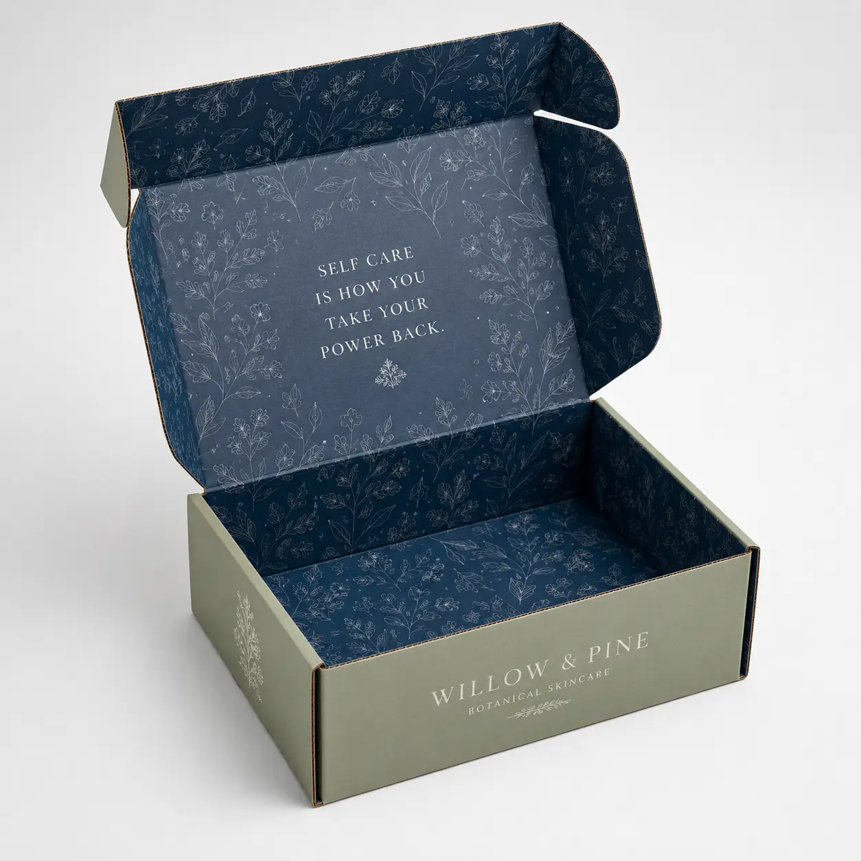 Sage green custom mailer box with navy floral interior print and self care quote for Willow & Pine botanical skincare brand