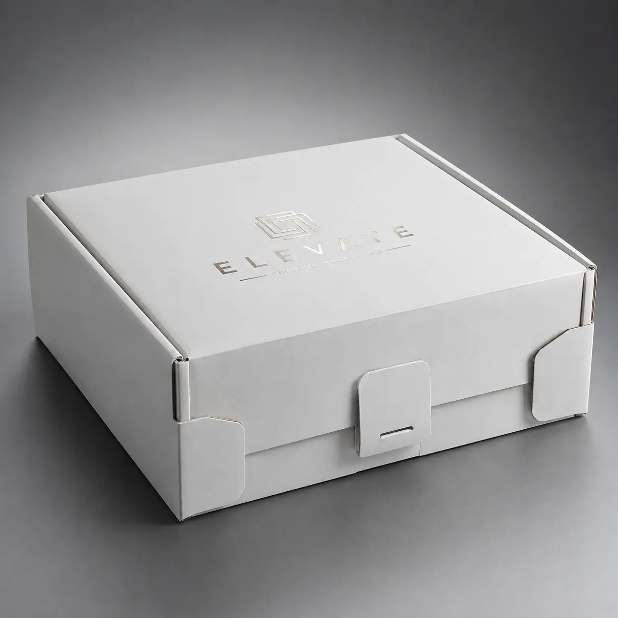 White luxury custom mailer box with silver foil logo, premium rigid packaging with locking tabs, elegant unboxing experience