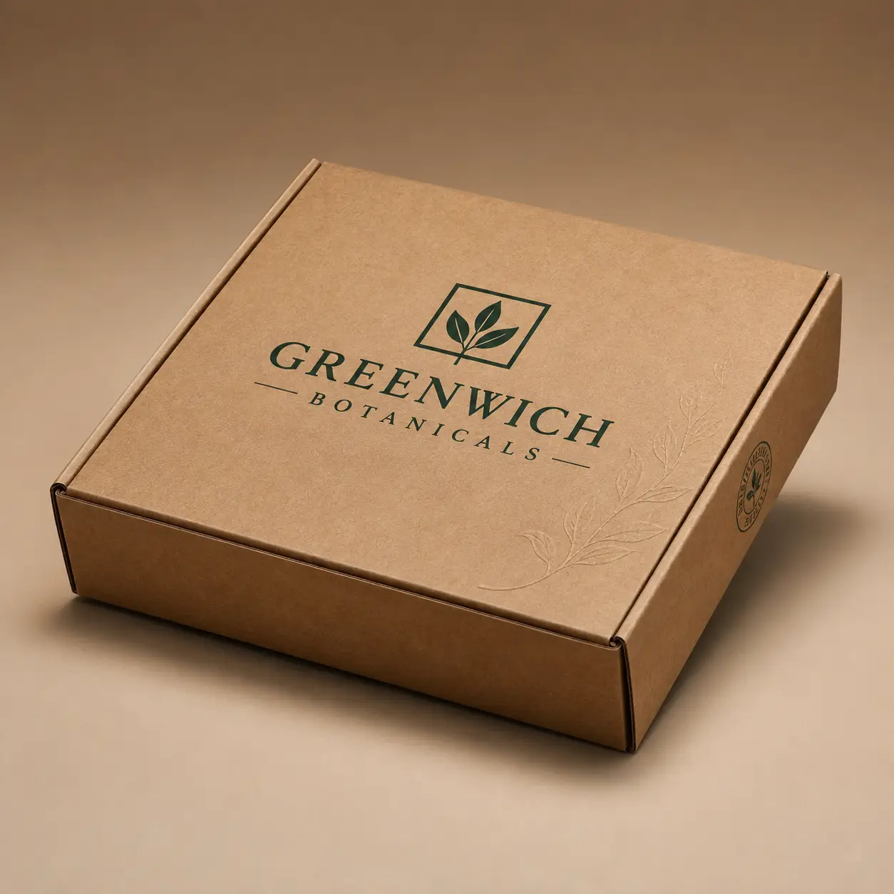 Kraft brown corrugated mailer box with dark green Greenwich Botanicals logo and embossed leaf design on tan background