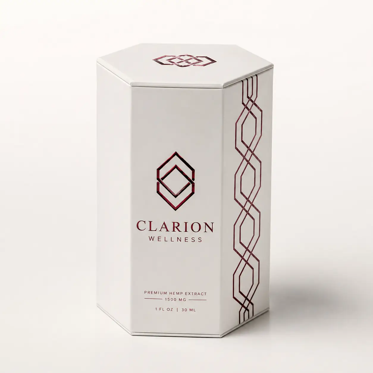 Clarion Wellness premium hemp extract 1500mg white hexagonal luxury CBD packaging box with dark red geometric design