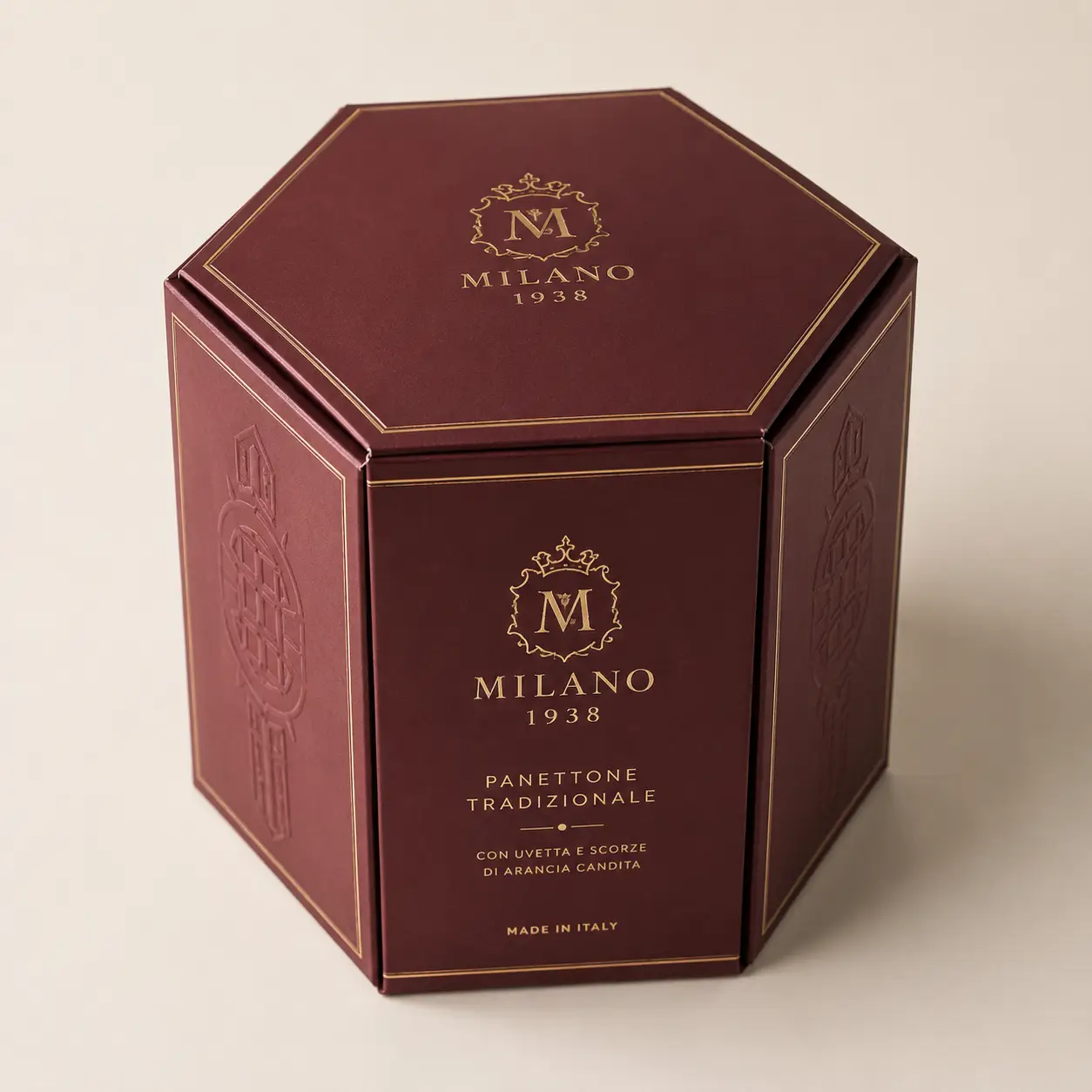 Luxury burgundy octagonal panettone box Milano 1938 with gold foil branding, made in Italy premium holiday packaging design