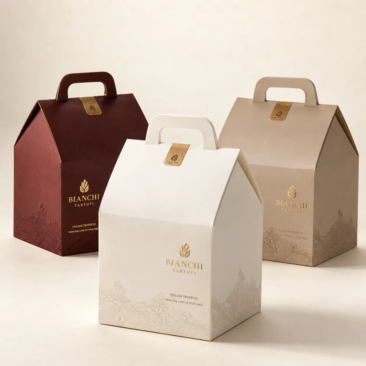 Bianchi Tartufi luxury Italian truffle gift boxes in white, burgundy, and beige with gold foil branding and handle tops