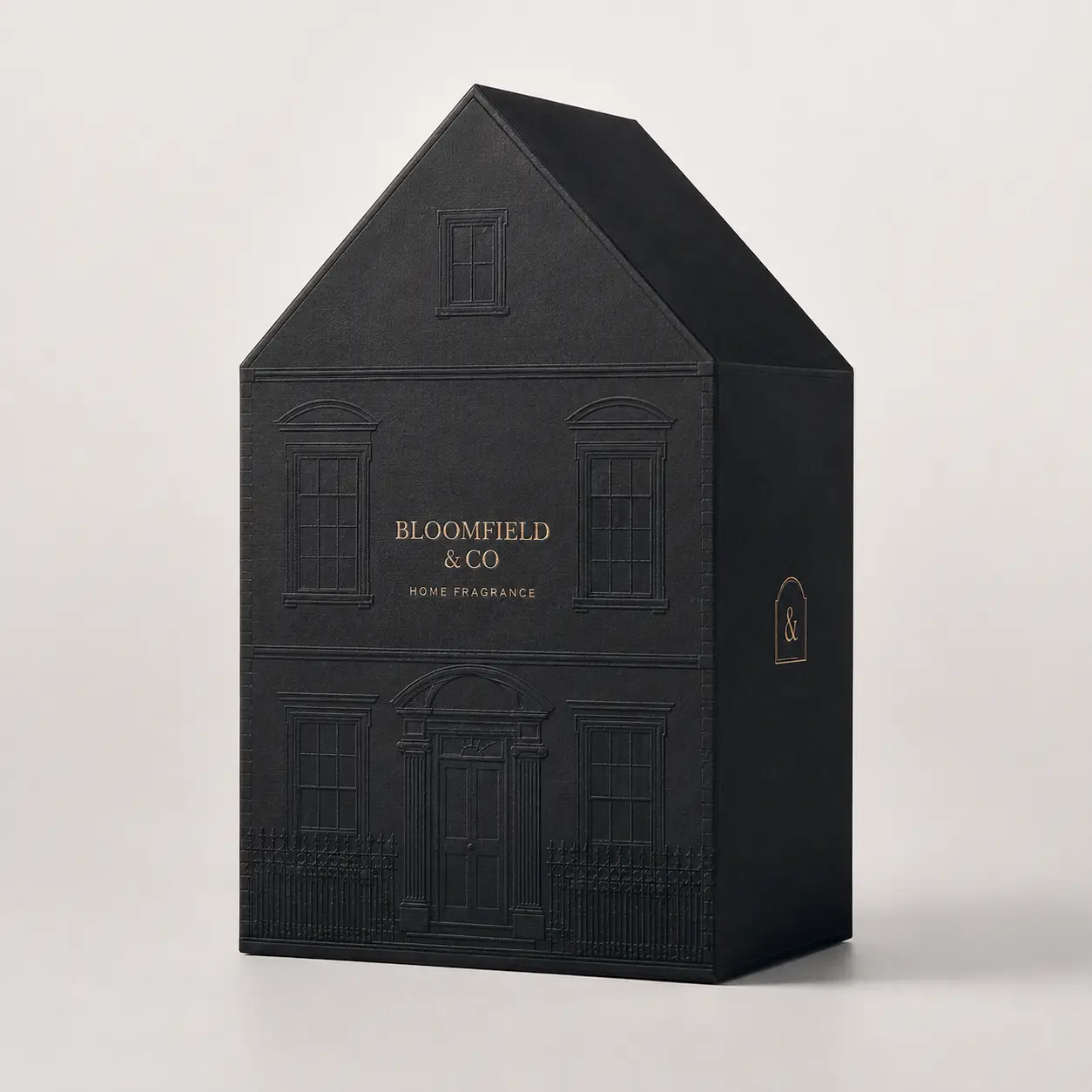 Bloomfield & Co black house-shaped luxury home fragrance gift box with gold foil embossed facade detail
