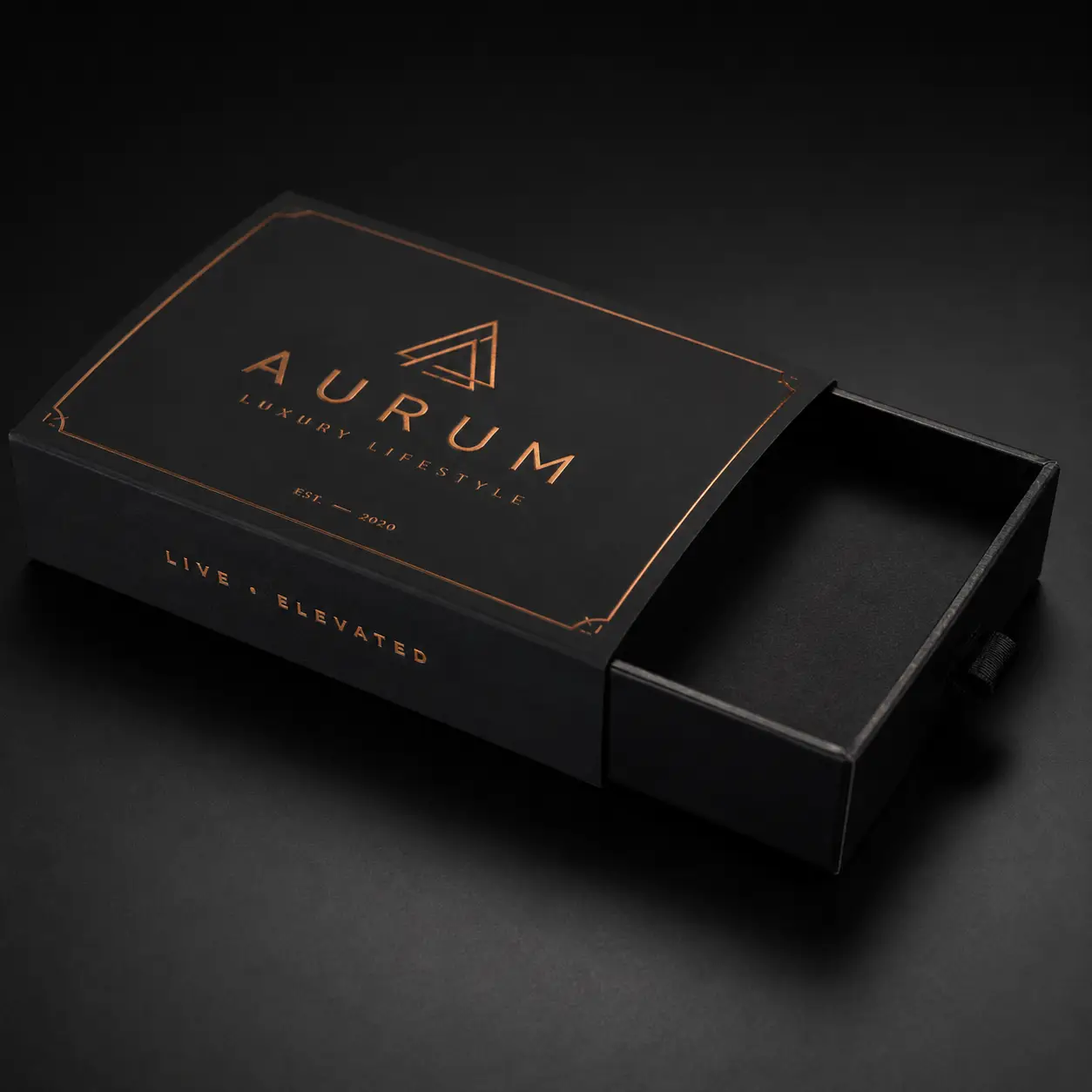 Aurum Luxury Lifestyle black sliding drawer gift box with rose gold foil logo and Live Elevated tagline, EST 2020