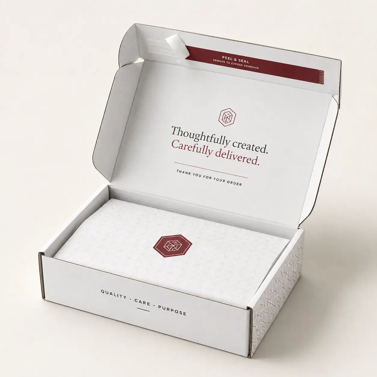 White custom mailer box open revealing burgundy peel-seal strip, tissue paper, and elegant branding with quality packaging design