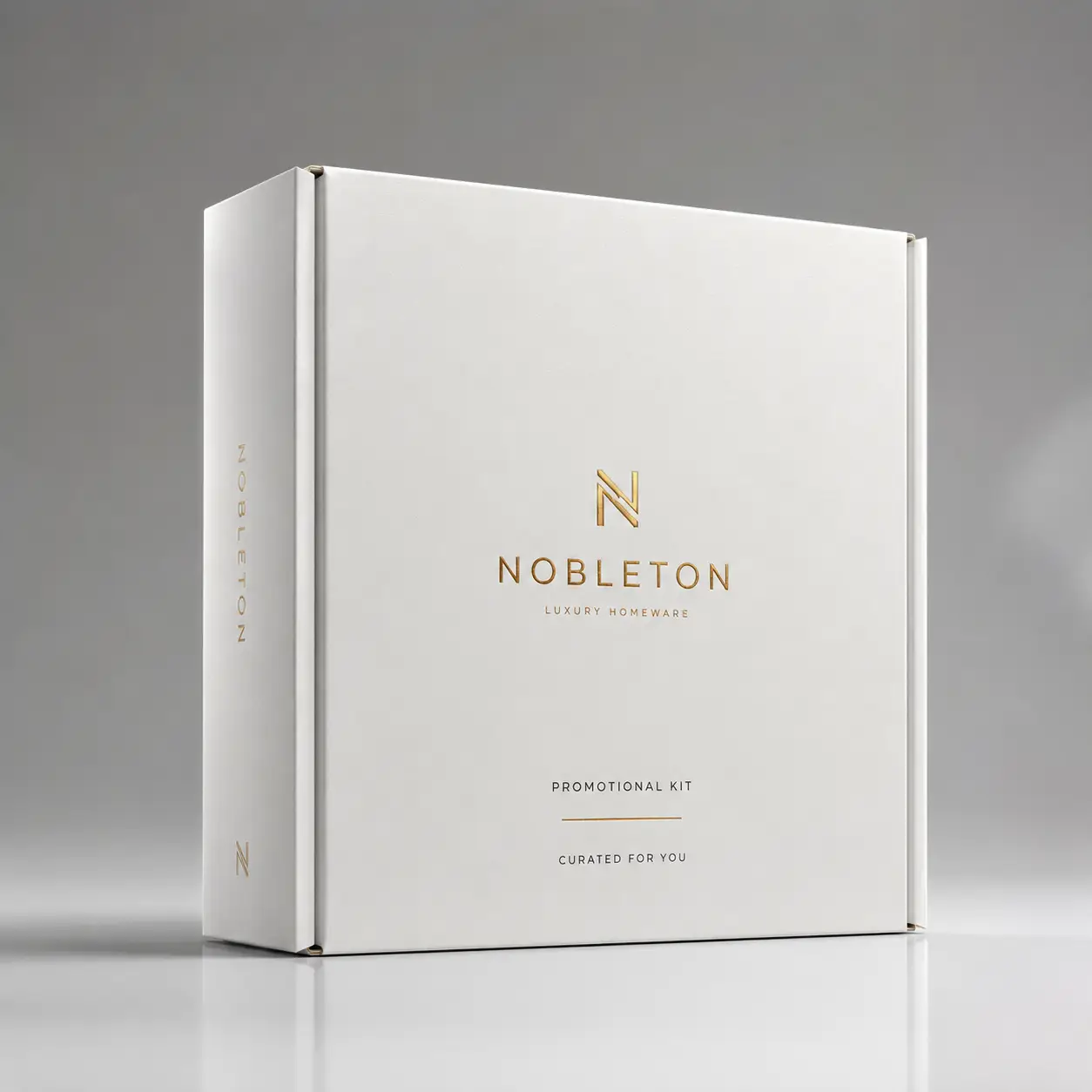 Nobleton Luxury Homeware white promotional gift box with gold foil logo, elegant minimalist packaging design on gray background