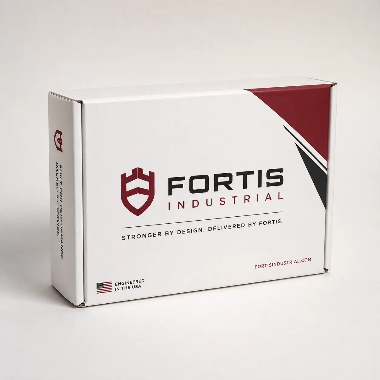 White Fortis Industrial branded product box with dark red shield logo, black diagonal accents, engineered in USA label