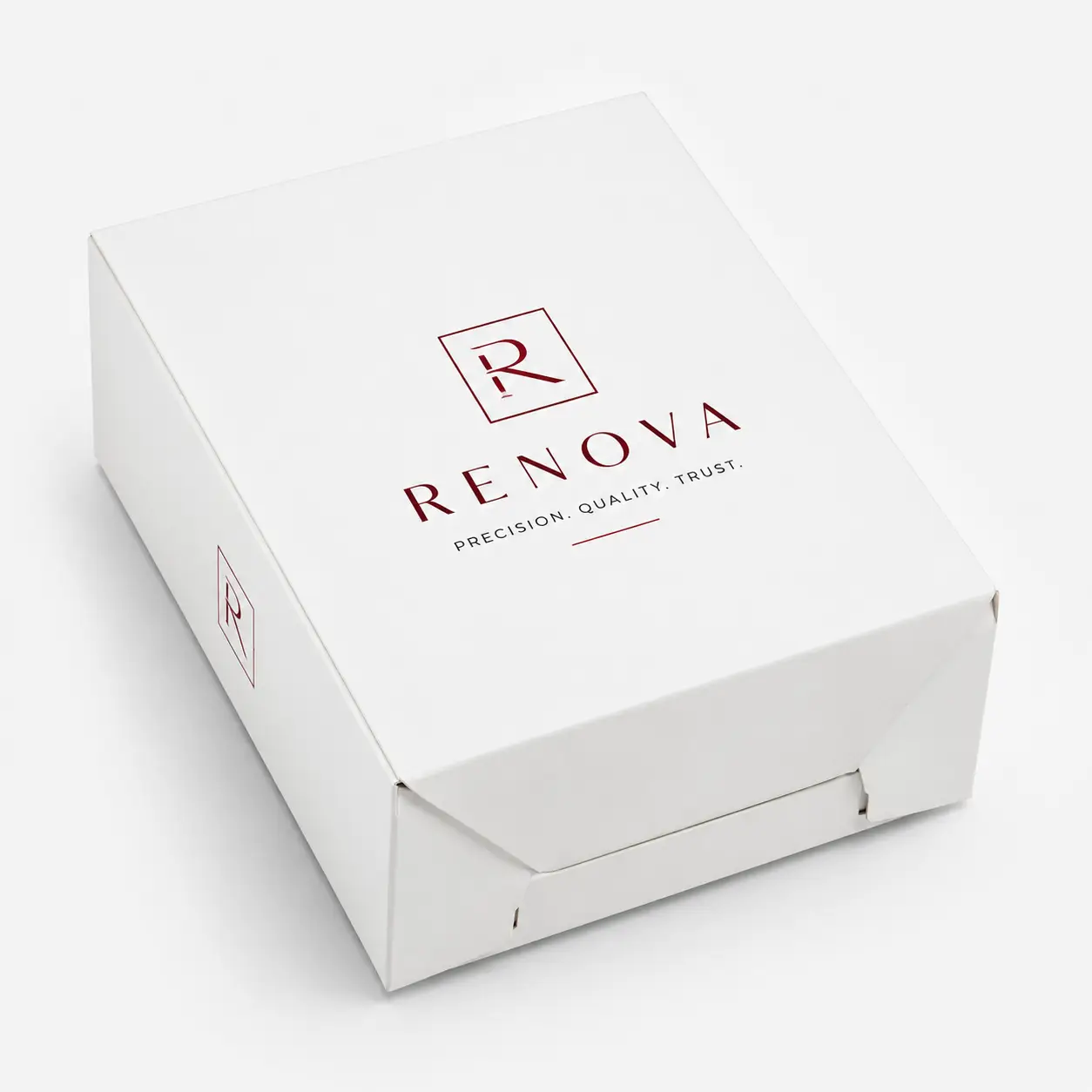 White luxury custom printed box with dark red Renova logo and tagline Precision Quality Trust on premium packaging design