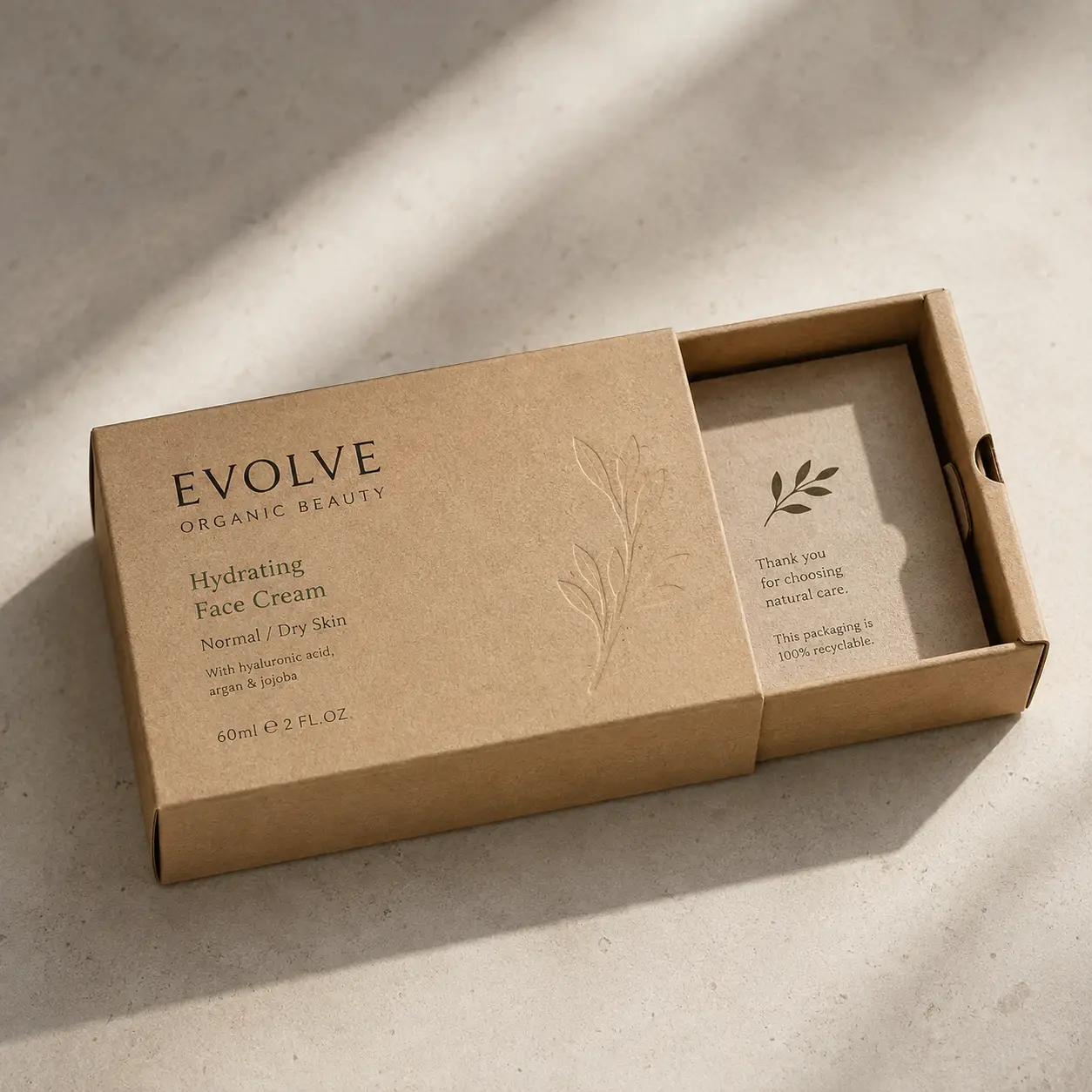 Evolve Organic Beauty kraft brown recyclable sliding box packaging for Hydrating Face Cream, natural minimalist design, soft sunlight