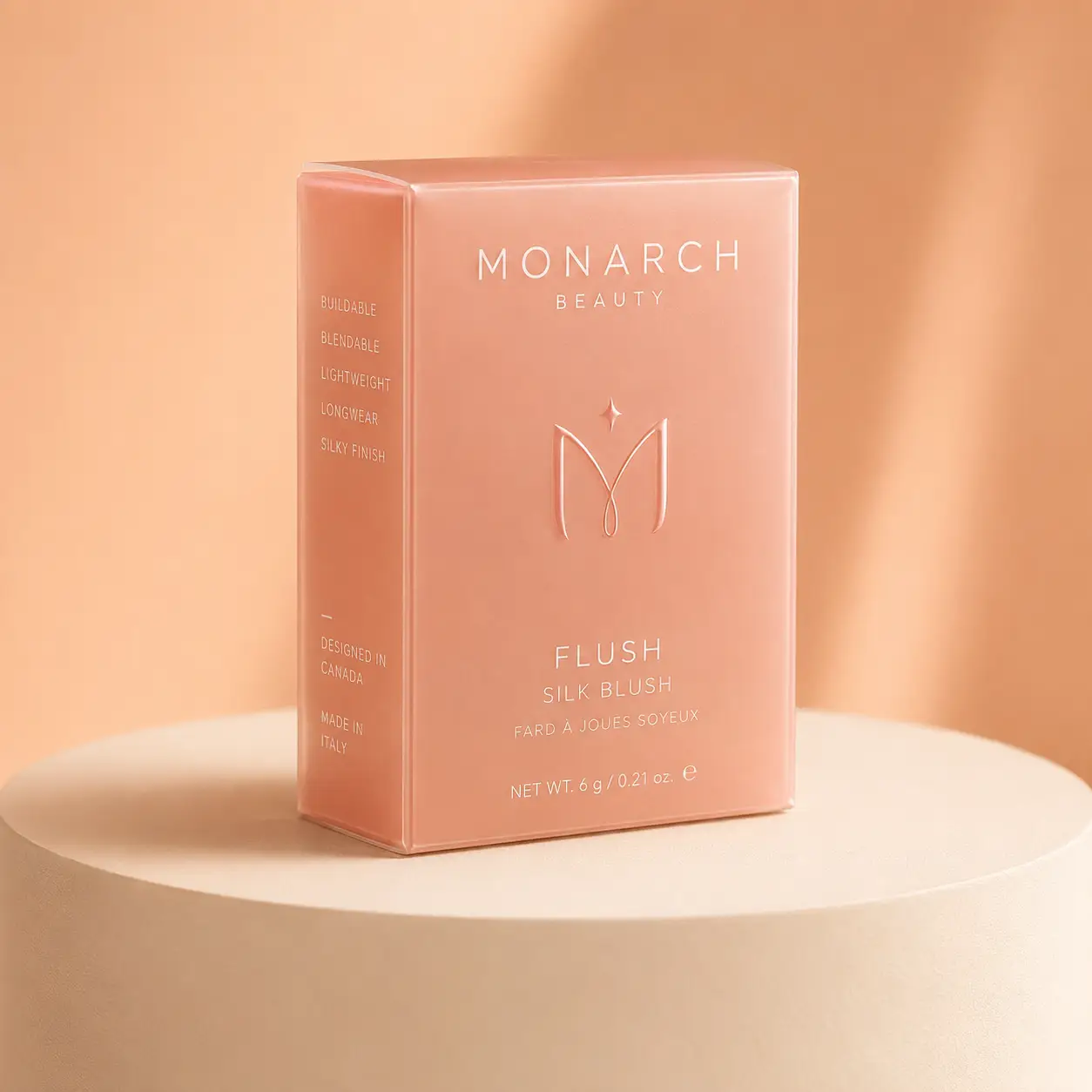 Monarch Beauty Flush Silk Blush pink cosmetic box packaging on white pedestal, soft peach background, luxury beauty product design