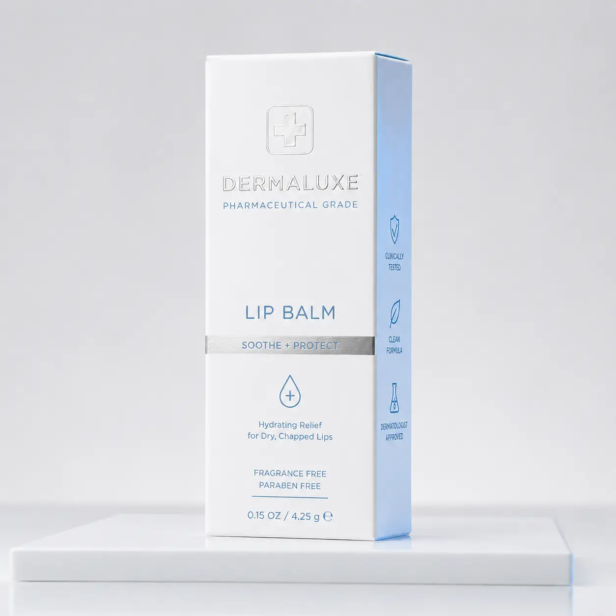 Dermaluxe pharmaceutical grade lip balm white box packaging with blue accents, clinically tested, fragrance free, 4.25g