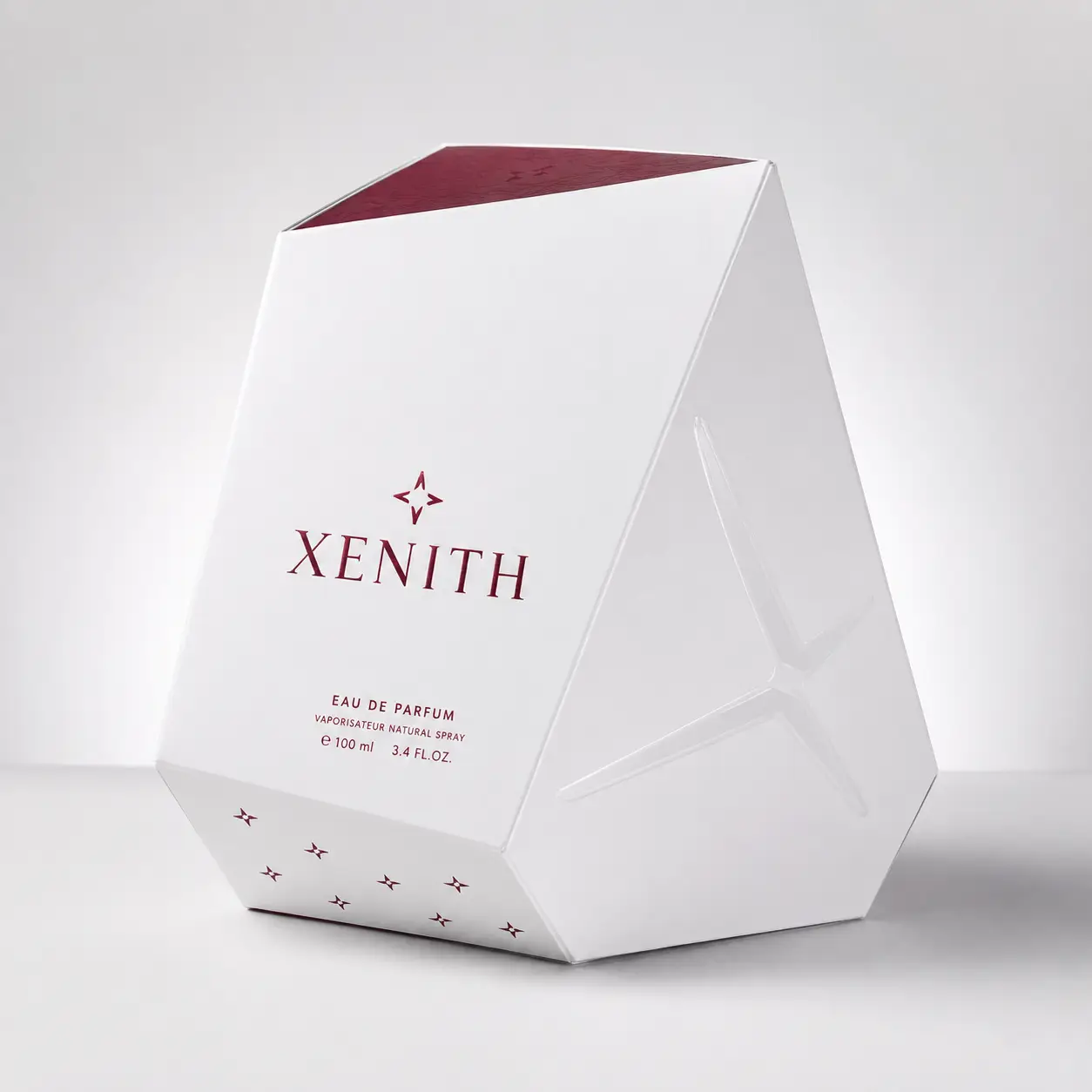 Xenith Eau de Parfum 100ml luxury perfume box in white geometric diamond shape with burgundy branding and star motif
