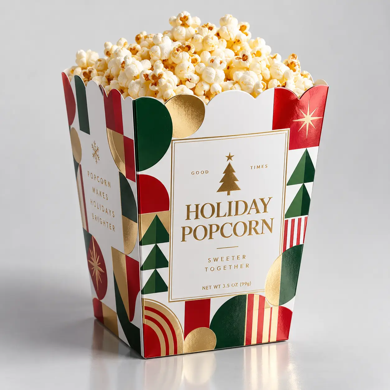 Holiday popcorn gift box with red, green, gold geometric design, Christmas tree logo, filled with fresh popcorn, festive packaging