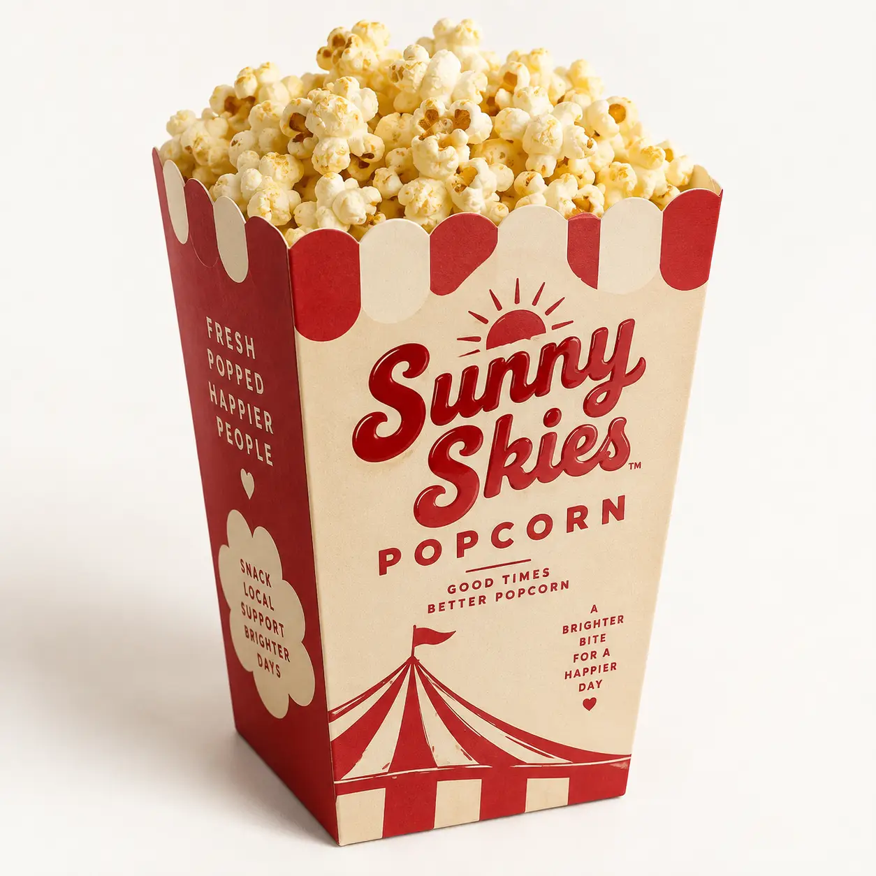 Red and cream vintage popcorn box packaging design for Sunny Skies Popcorn brand with circus tent graphics, filled with fresh popcorn
