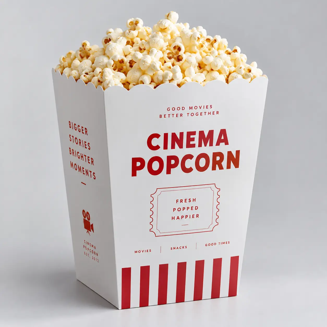 White red-striped cinema popcorn box overflowing with fresh popped corn, classic movie theater packaging design with bold typography