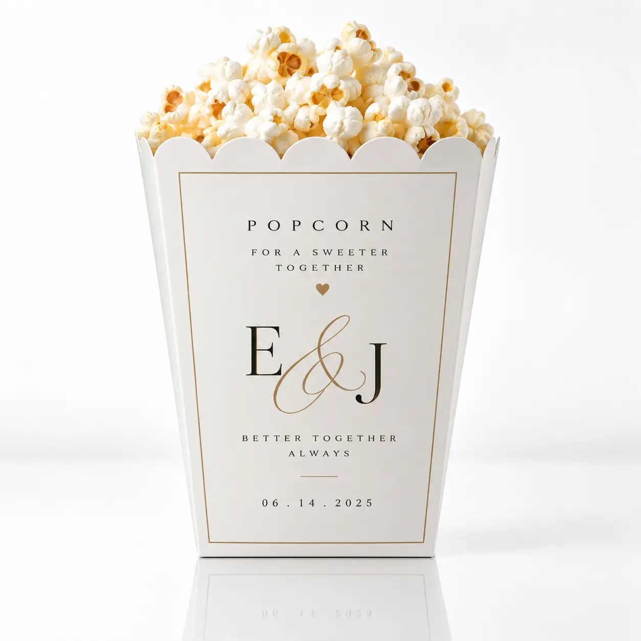 White wedding popcorn box favor with gold E&J monogram, scalloped edges, filled with popcorn, dated 06.14.2025