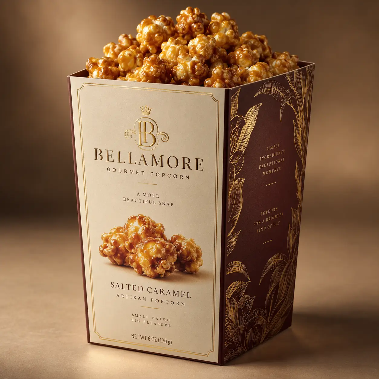 Bellamore gourmet salted caramel popcorn luxury packaging box, cream and burgundy design with gold botanical accents, overflowing snack