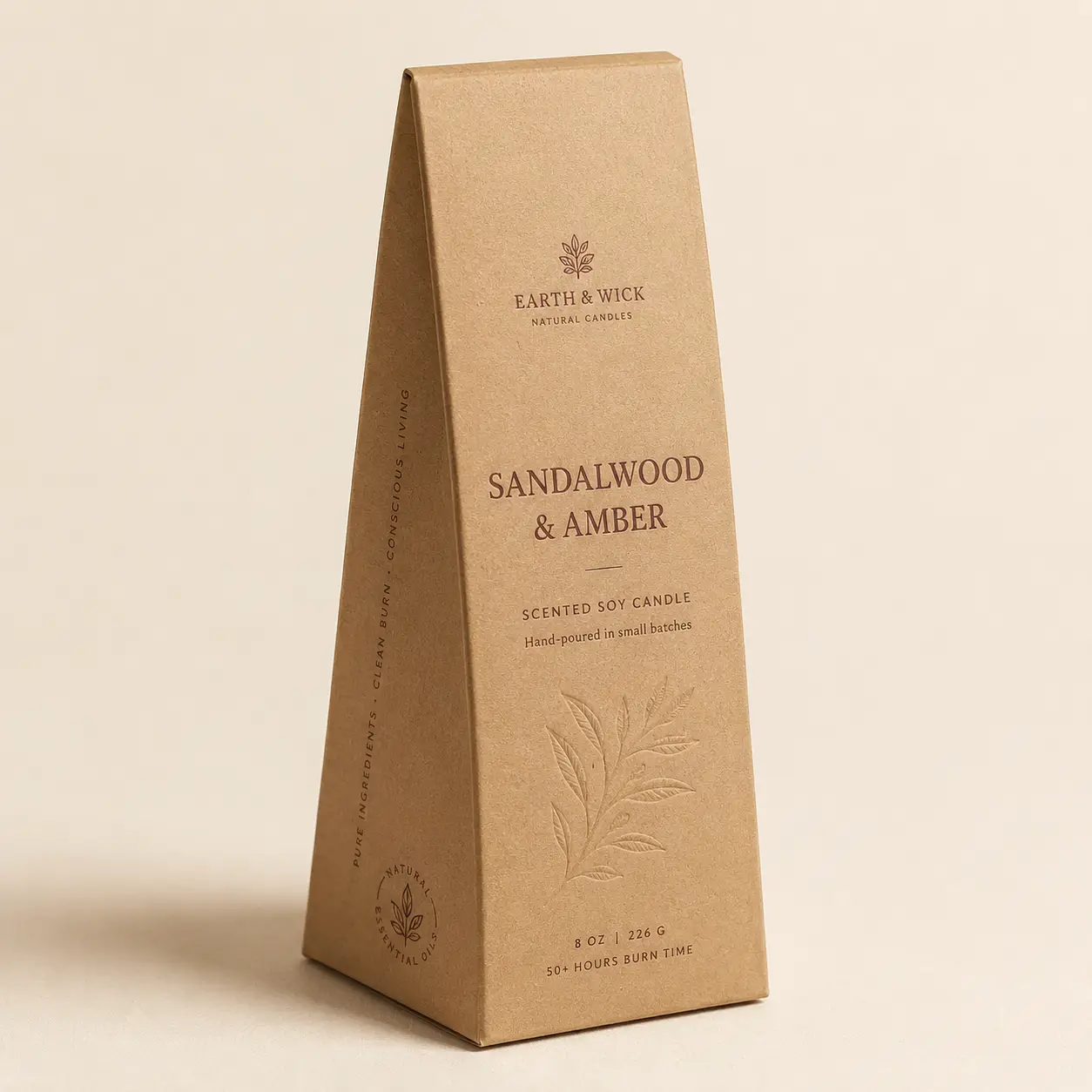Kraft brown triangular candle box packaging for Earth & Wick Sandalwood & Amber 8oz soy candle with embossed botanical design