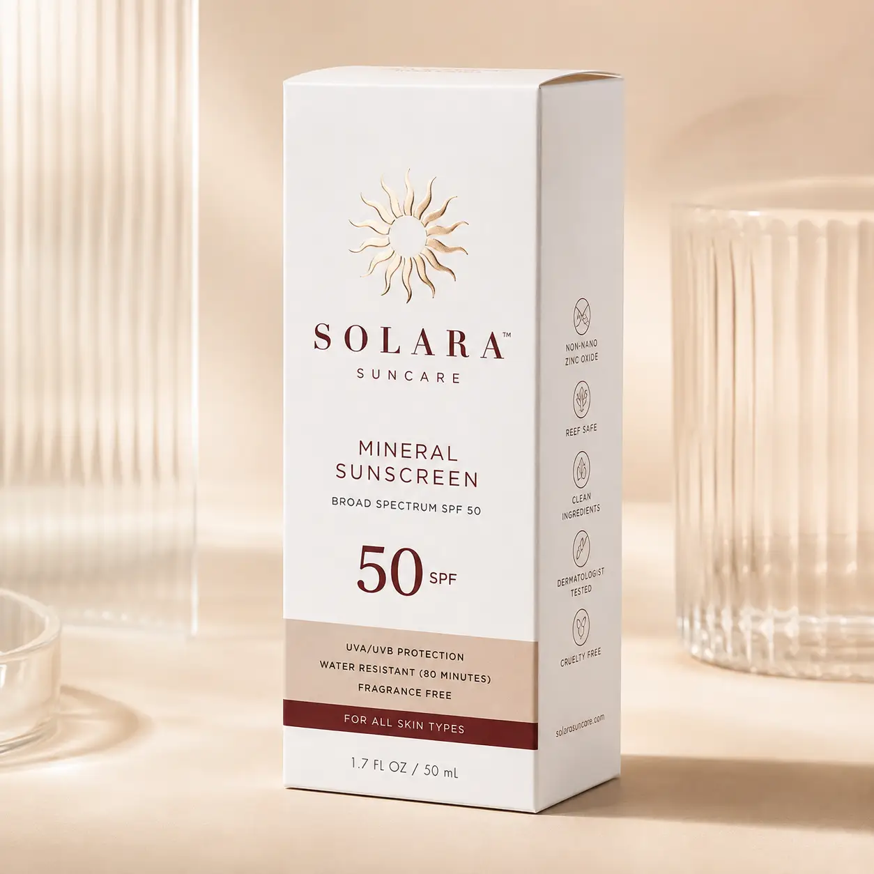 Solara Suncare SPF 50 mineral sunscreen white box with gold sun logo on beige background, reef-safe cruelty-free packaging design