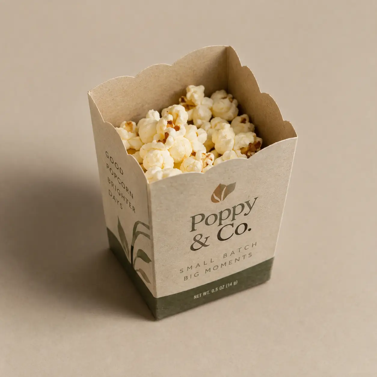 Poppy & Co. kraft popcorn box packaging, sage green botanical design, small batch branding, filled with fresh popcorn