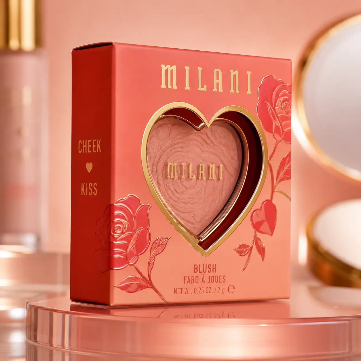 Milani Cheek Kiss blush compact in heart-shaped gold window, coral-red floral packaging, 7g luxury cosmetic product display
