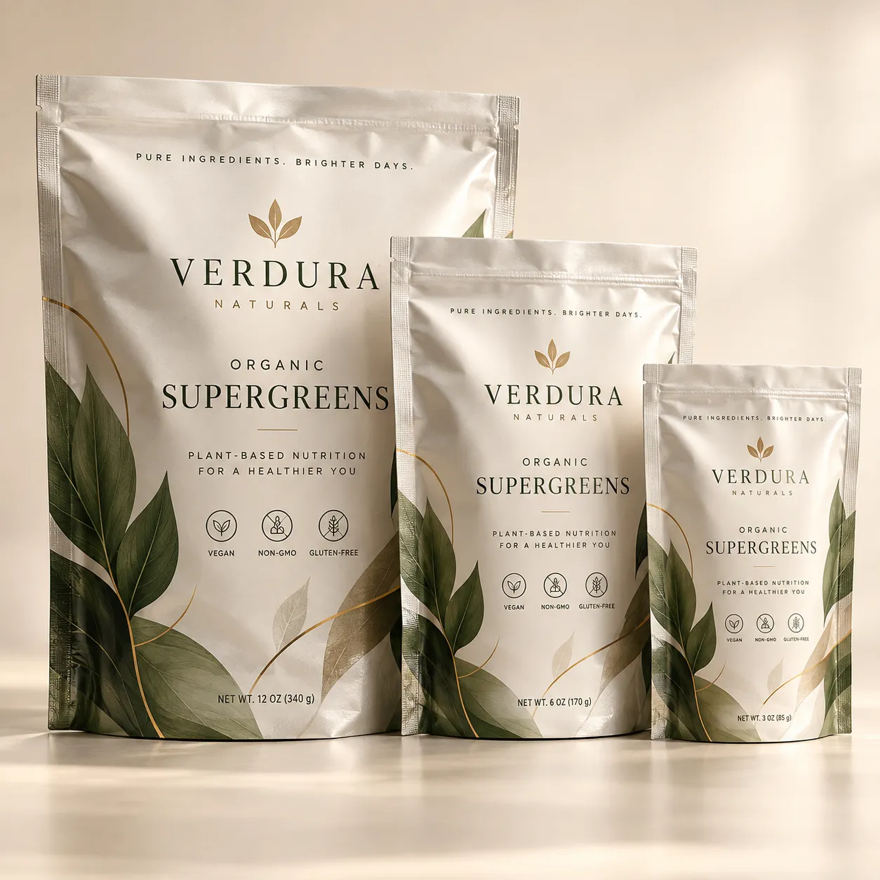 Three sizes of Verdura Naturals Organic Supergreens white pouches with green leaf design, vegan non-GMO gluten-free supplement packaging