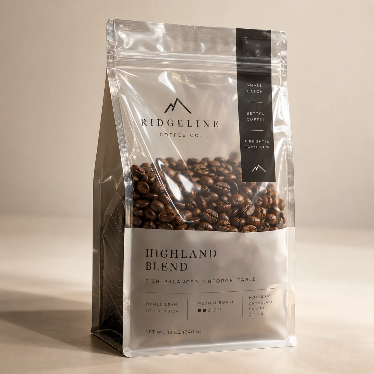 Silver coffee bag packaging for Ridgeline Coffee Co. Highland Blend medium roast whole bean, featuring visible dark roasted arabica beans