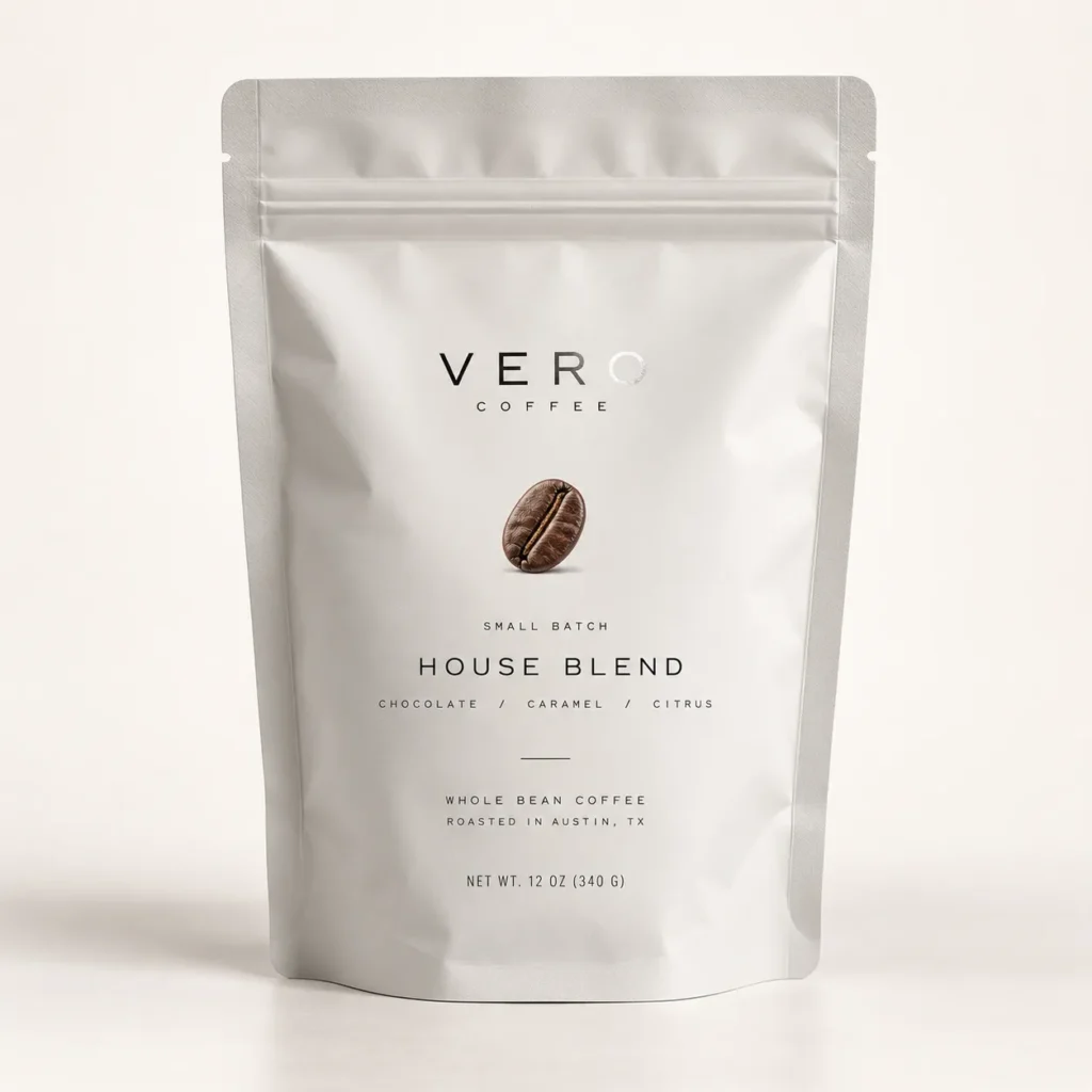 Vero Coffee House Blend silver stand-up pouch packaging, whole bean coffee bag roasted in Austin TX, minimalist white design