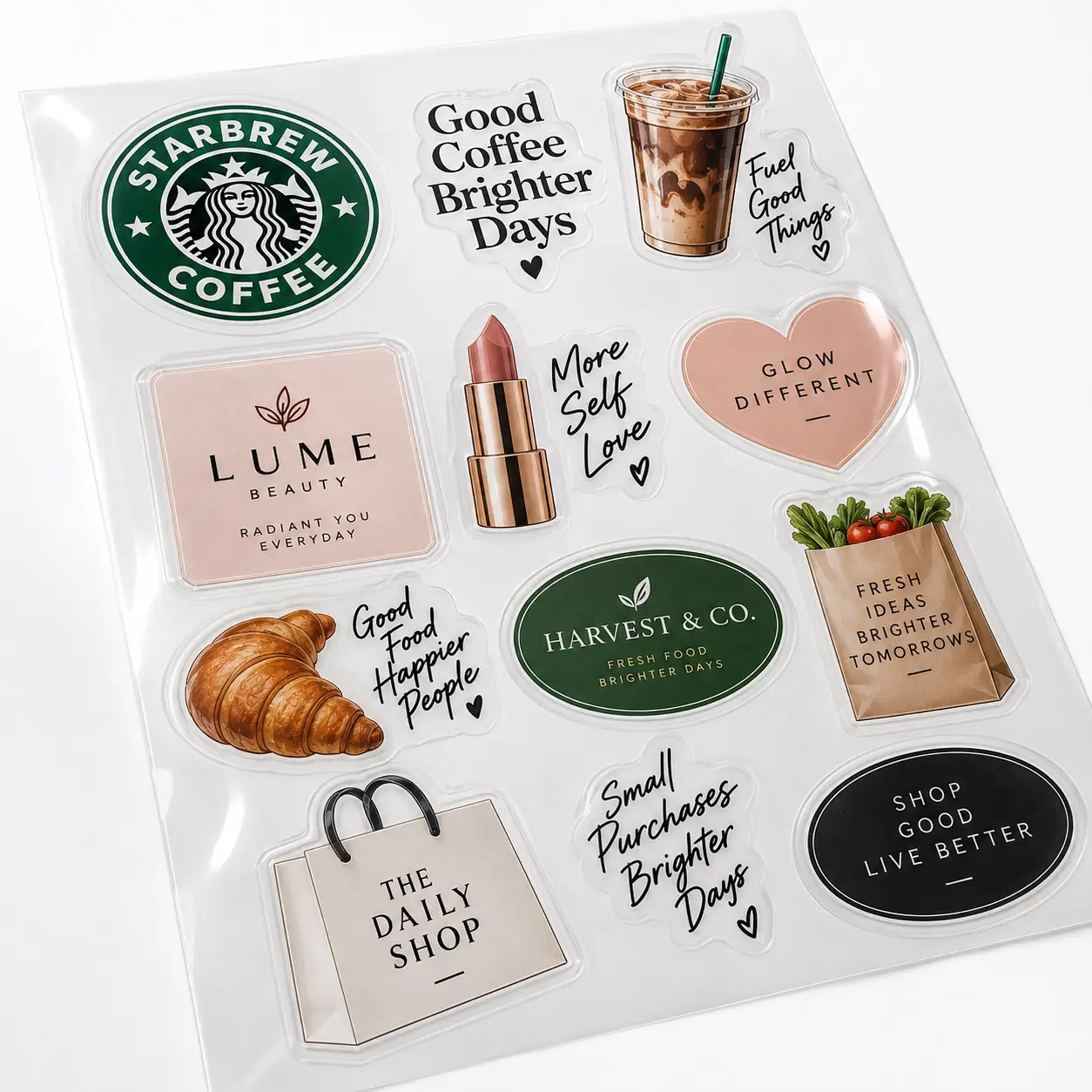 Custom sticker sheet with coffee, beauty, food brand logos in green, pink, black tones — perfect custom packaging stickers printing