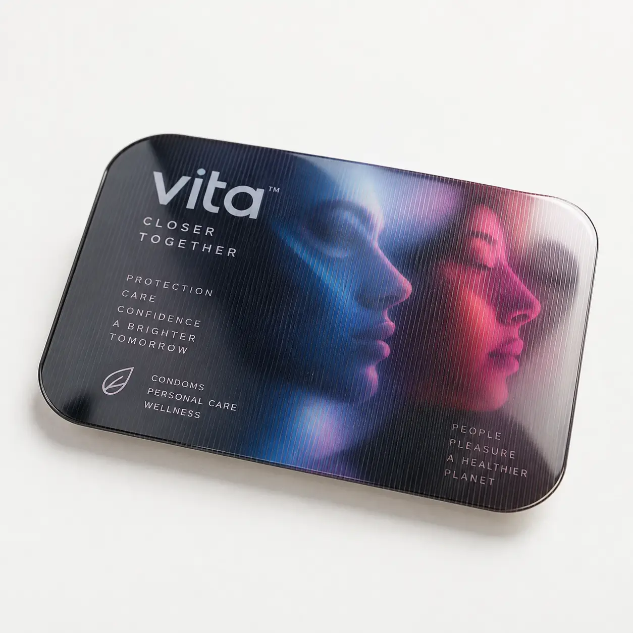 Vita condom brand tin packaging with blue pink duo-tone faces, custom printed wellness product box design by packaging masters