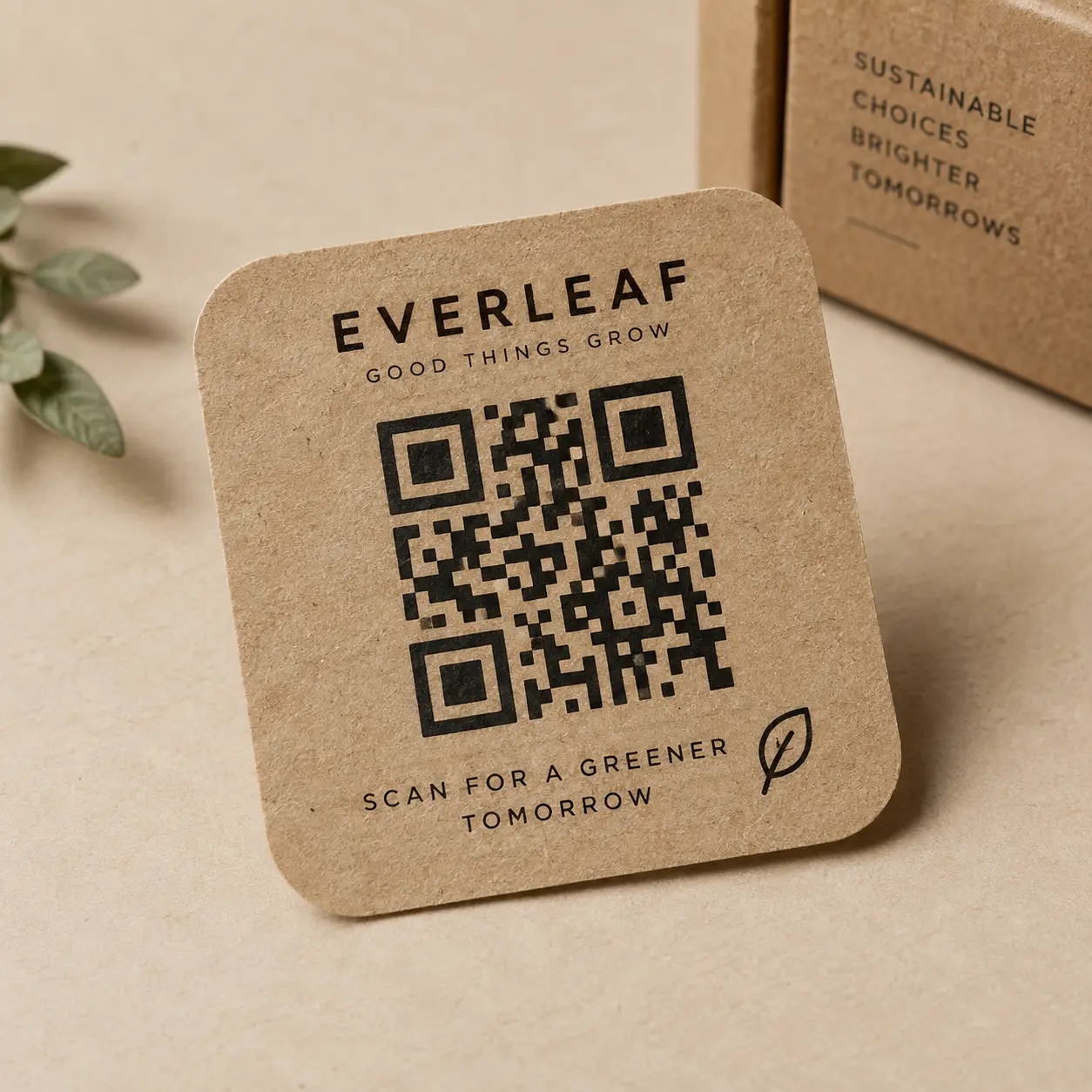 Kraft paper QR code card for Everleaf brand with eco-friendly packaging, leaf icon, and sustainable messaging on beige background