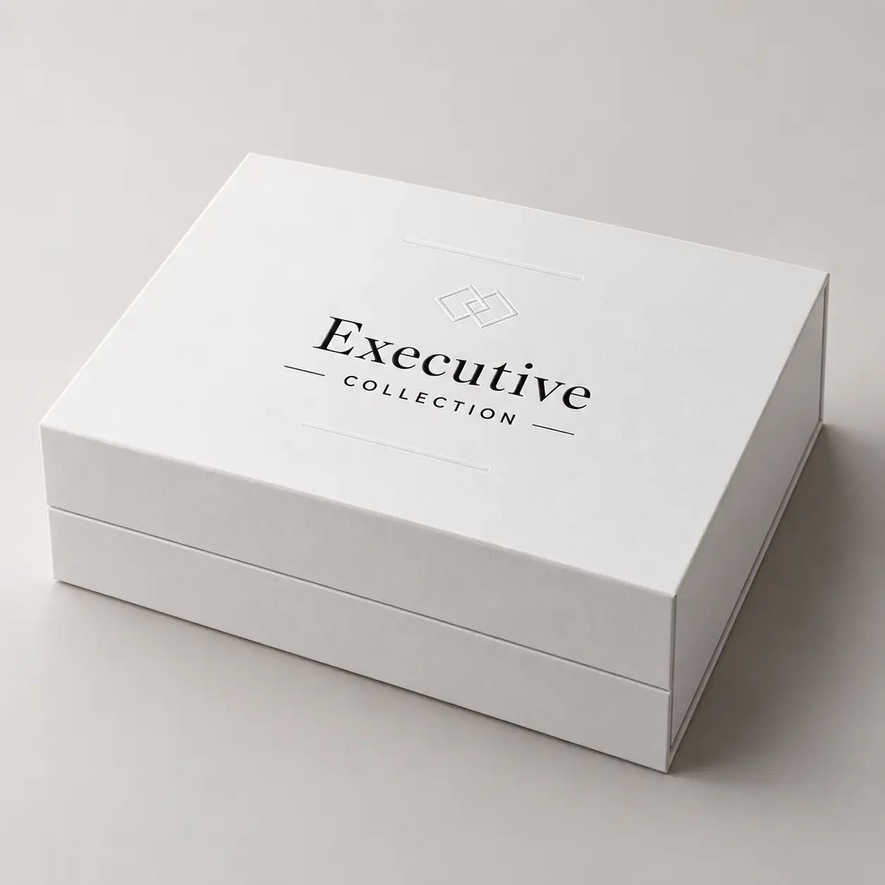 White luxury rigid gift box with Executive Collection embossed logo, premium packaging design by The Packaging Masters