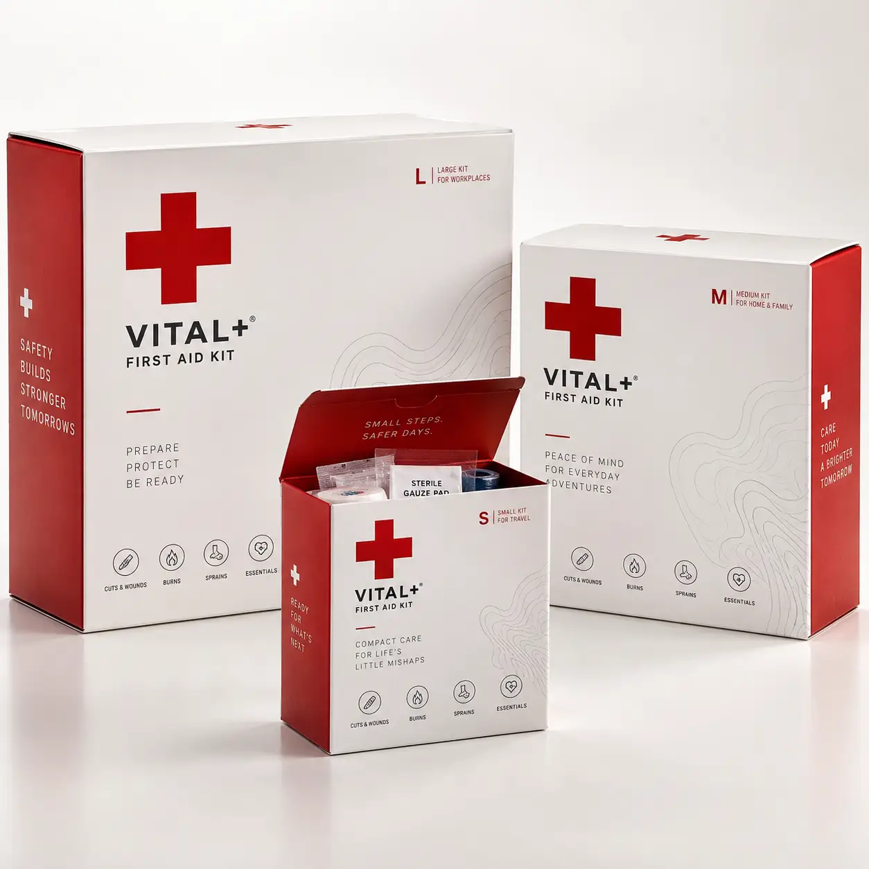 Vital+ First Aid Kit packaging in three sizes: large, medium, small, white and red boxes with medical cross logo
