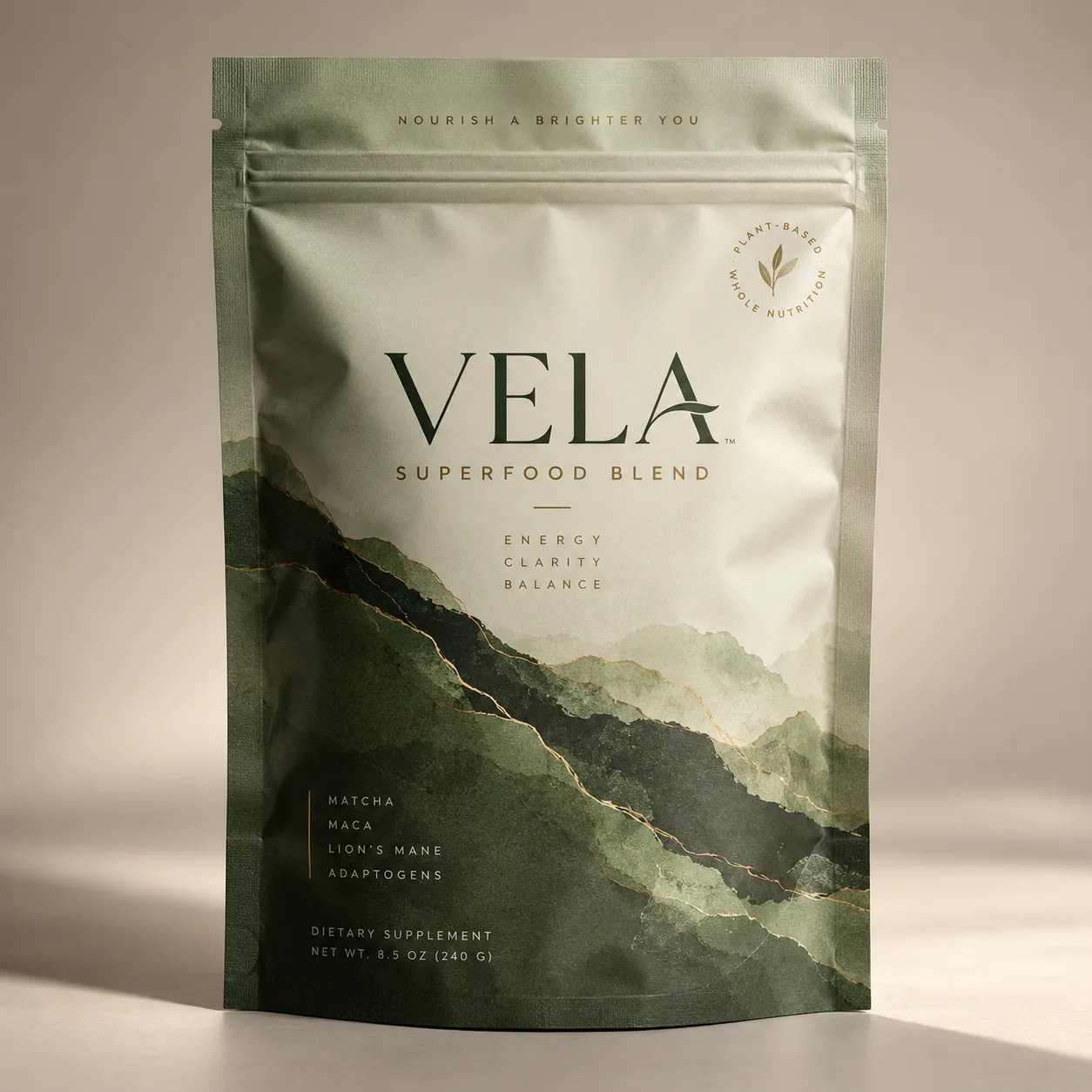 Vela Superfood Blend dietary supplement pouch in sage green with gold watercolor mountain design, matcha maca lion's mane adaptogens