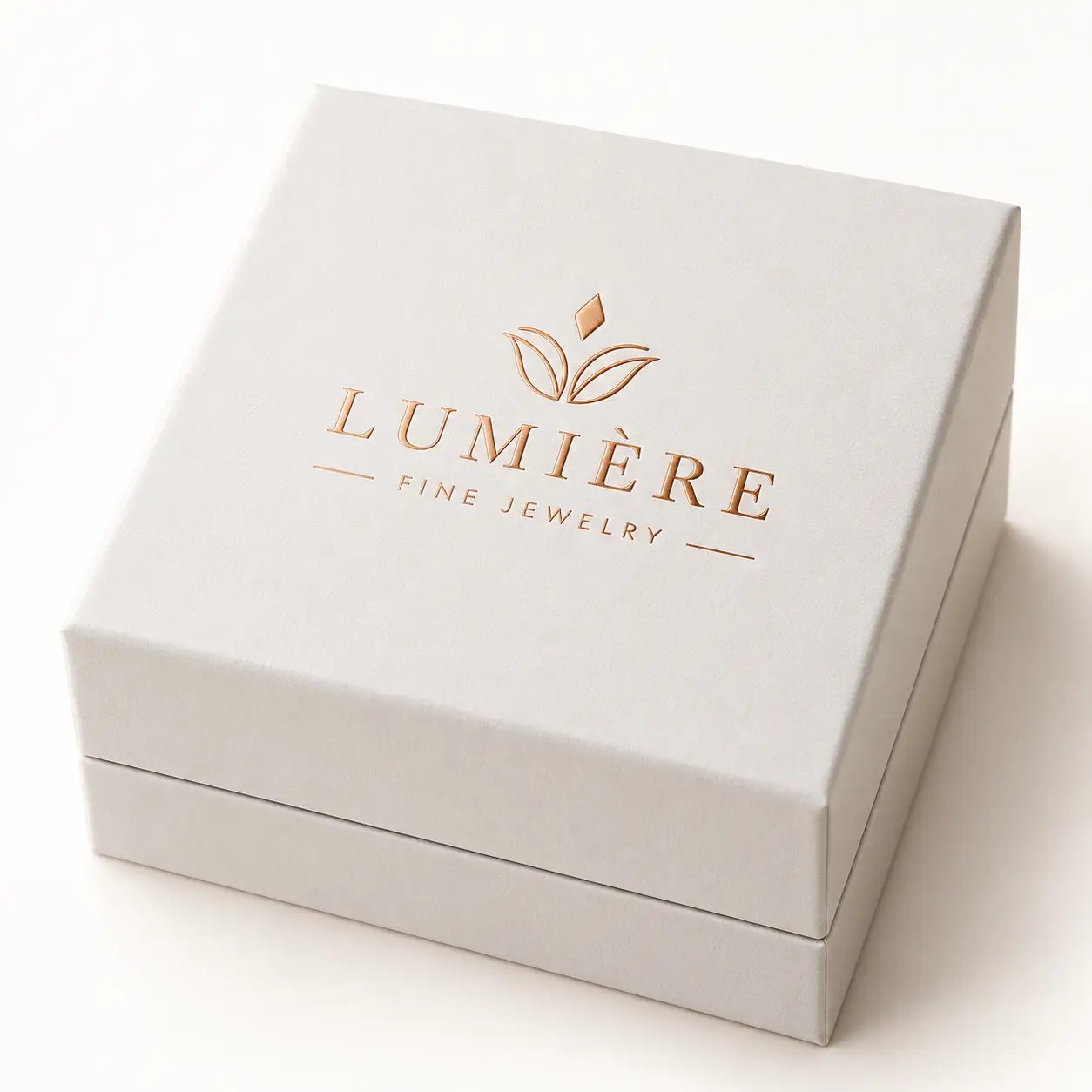 Lumière Fine Jewelry white luxury gift box with rose gold foil logo, elegant jewelry packaging design by The Packaging Masters