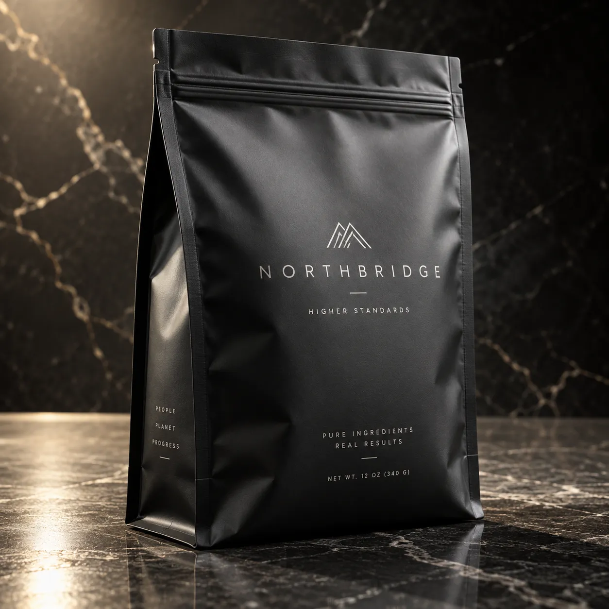 Matte black Northbridge supplement pouch on dark marble surface, silver minimalist mountain logo, premium luxury packaging design