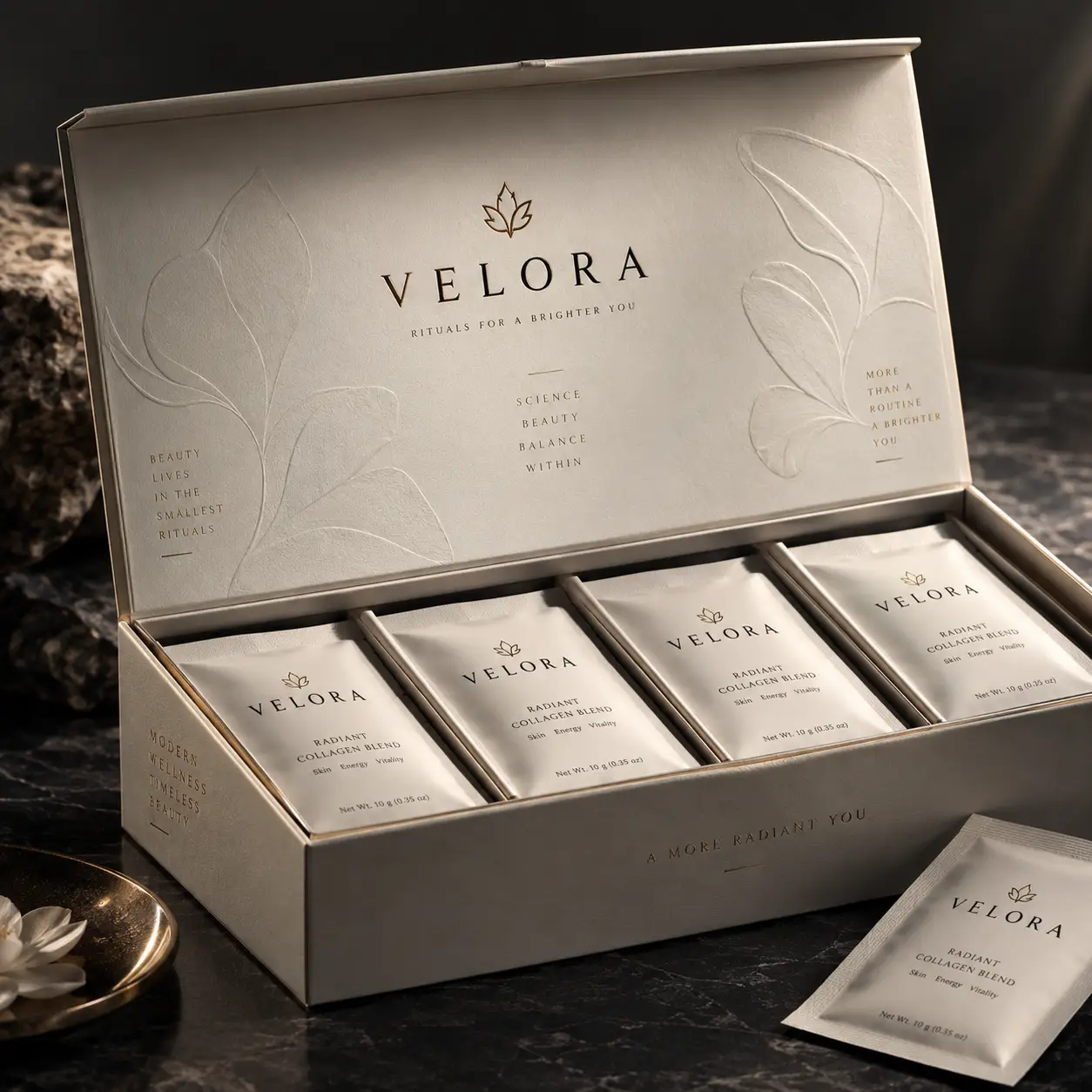 Velora luxury collagen blend packaging box open revealing cream sachets, elegant gold branding, marble surface, premium wellness design