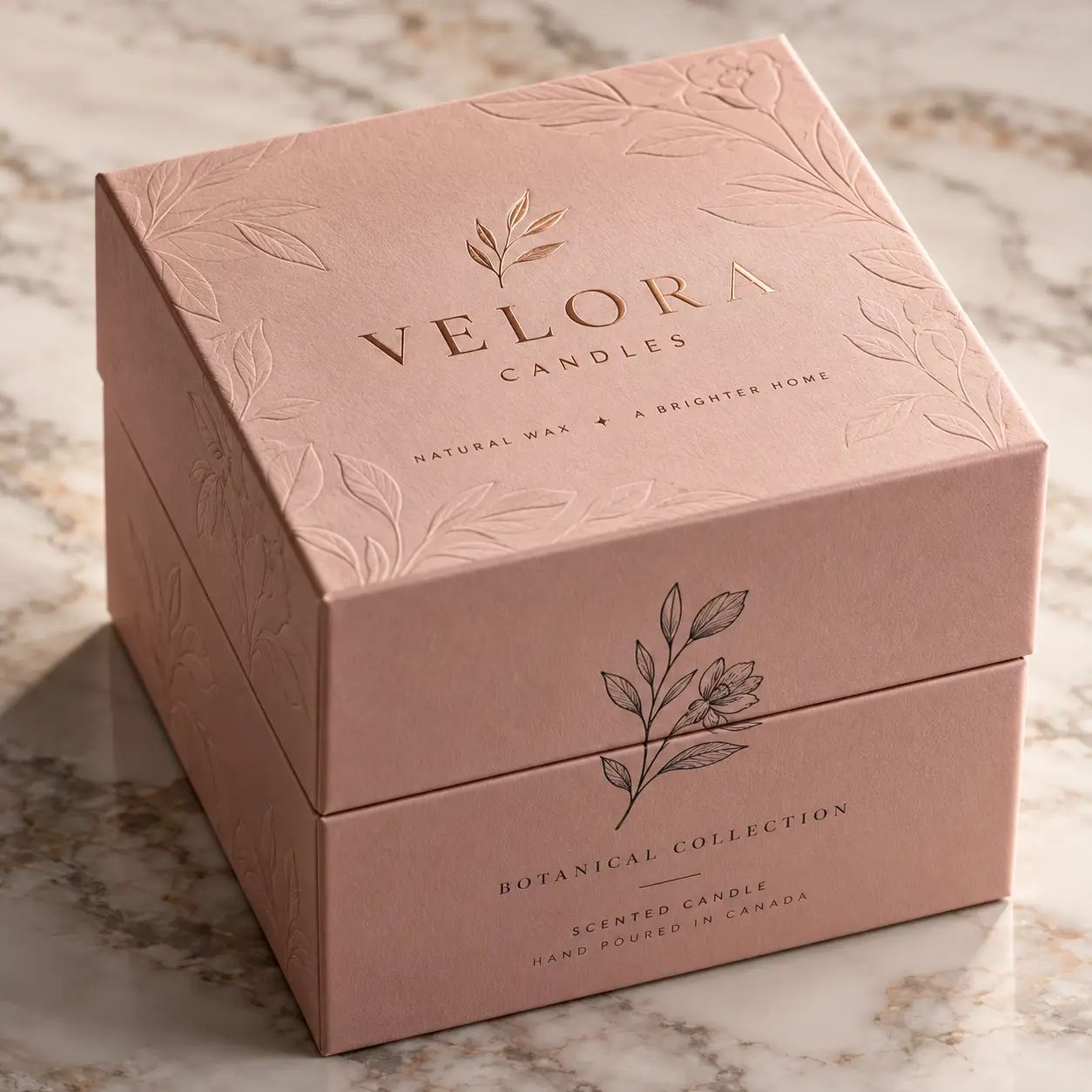 Velora Candles blush pink luxury gift box with gold foil botanical embossing, hand poured scented candle packaging design Canada