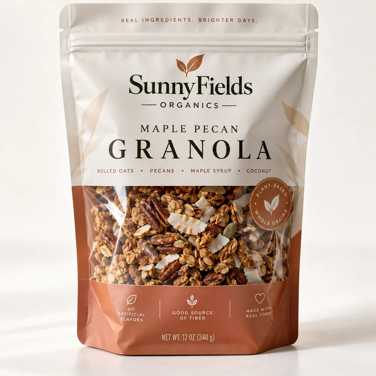 SunnyFields Organics Maple Pecan Granola 12oz resealable bag with warm terracotta and cream packaging showing rolled oats, pecans, coconut