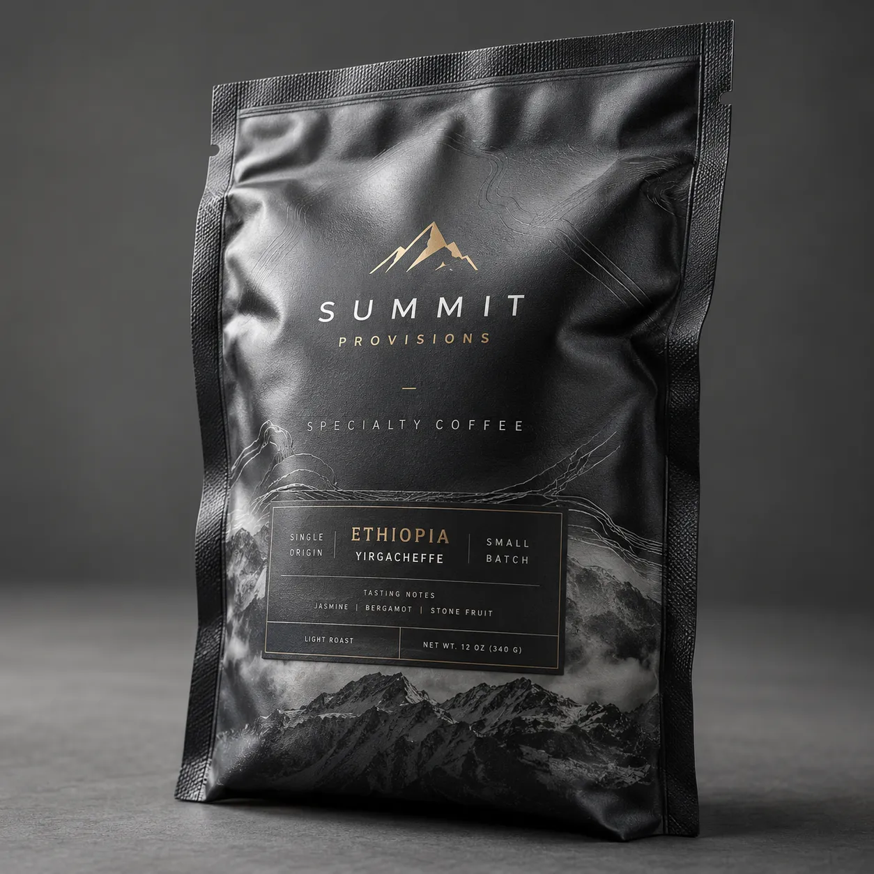 Black matte specialty coffee bag by Summit Provisions, Ethiopia Yirgacheffe light roast, gold mountain logo, premium packaging design