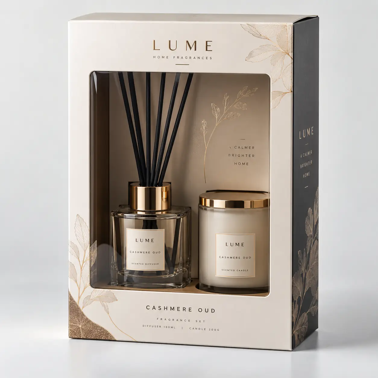 Lume Cashmere Oud luxury home fragrance gift set with gold reed diffuser and scented candle in elegant cream packaging